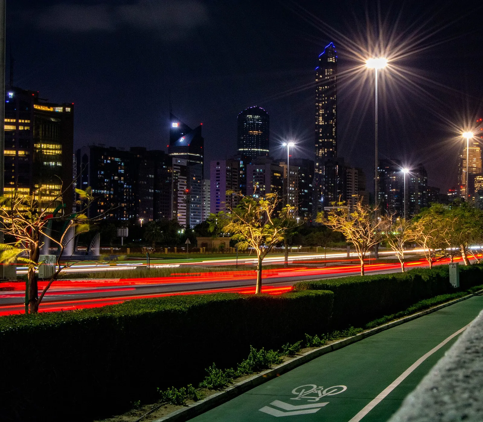 Corniche road and towers glowing at night