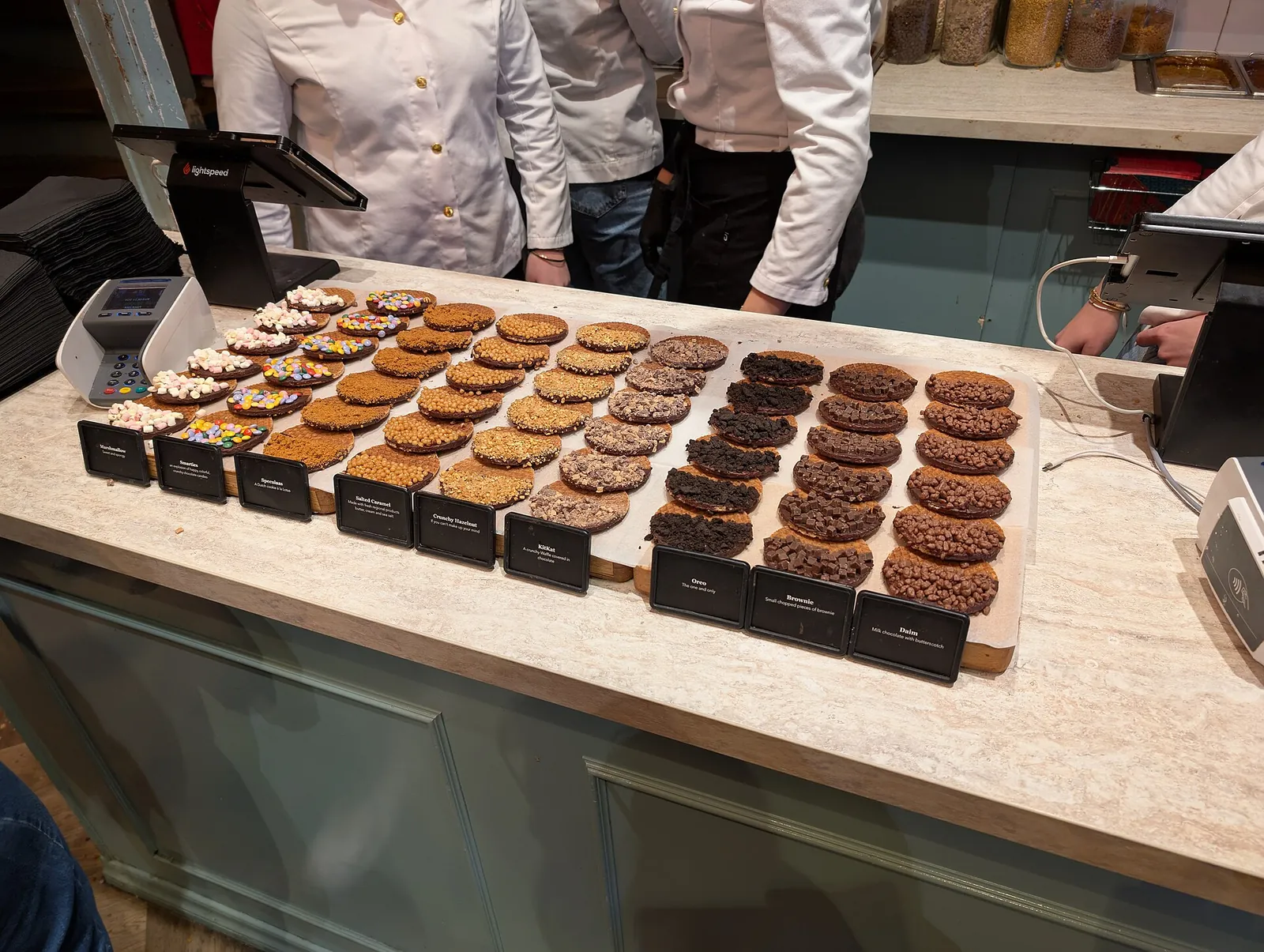 Fresh stroopwafels lined up on a shop counter