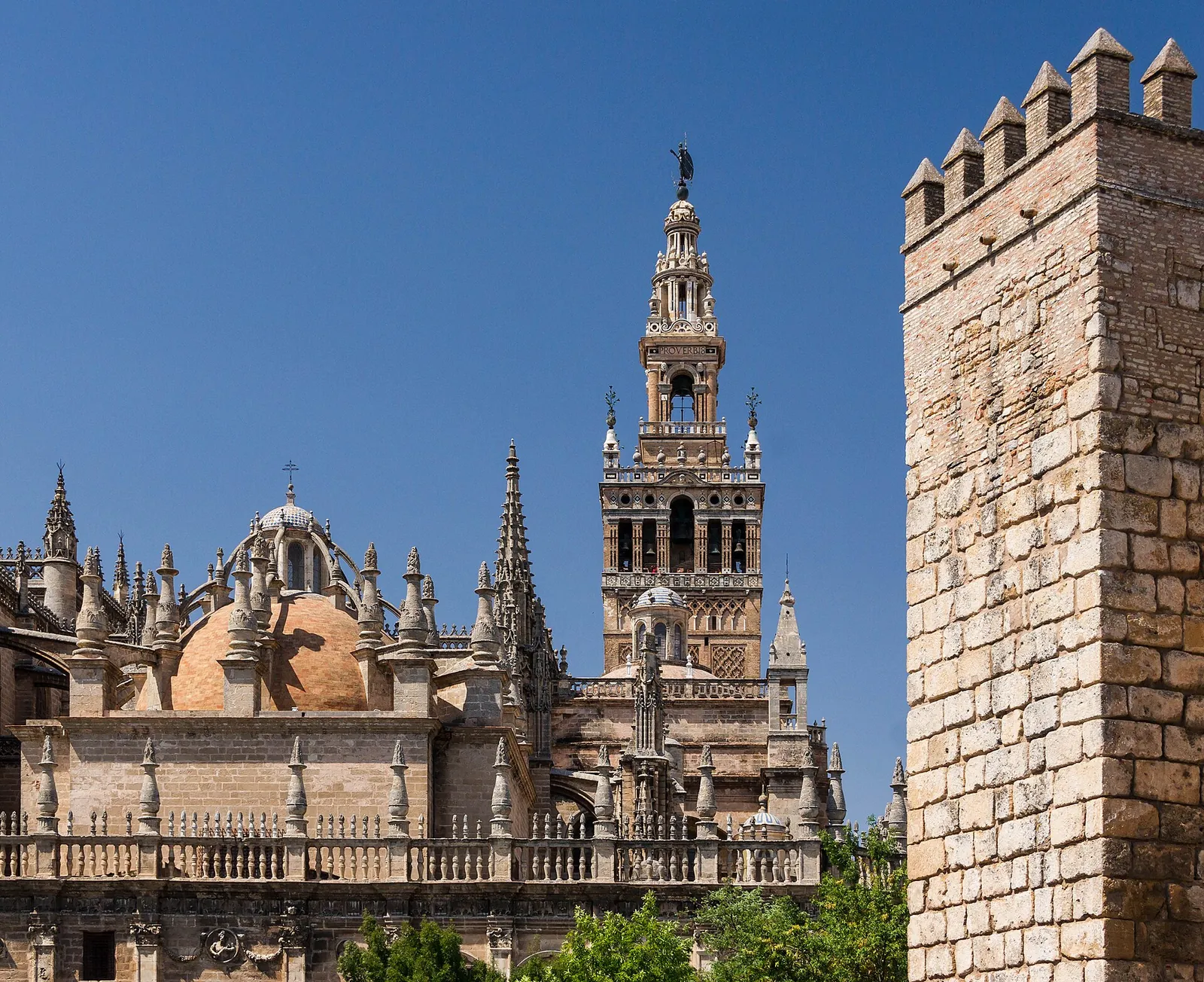 Seville Cathedral and the Giralda under a blue sky