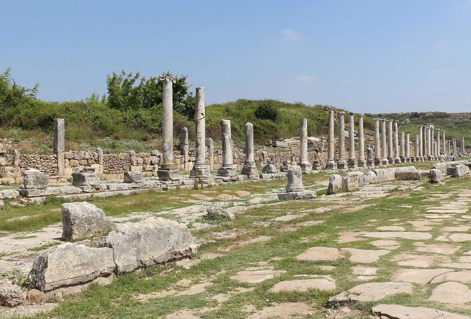 Colonnaded street under blue sky at Perge