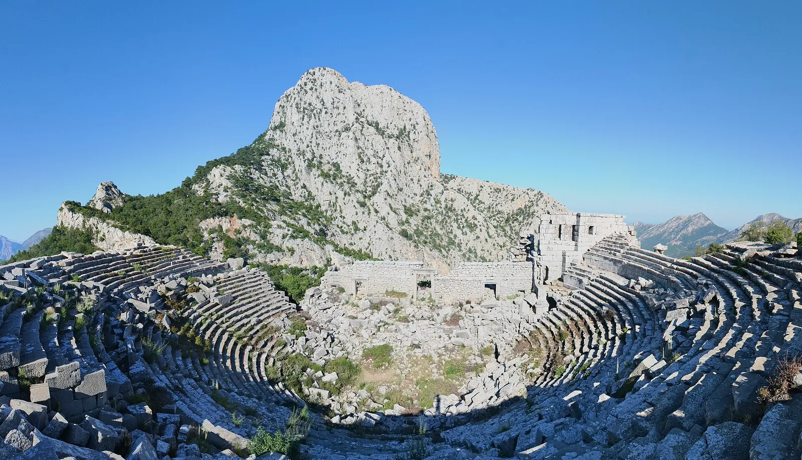 Termessos theatre beneath a rocky mountain peak