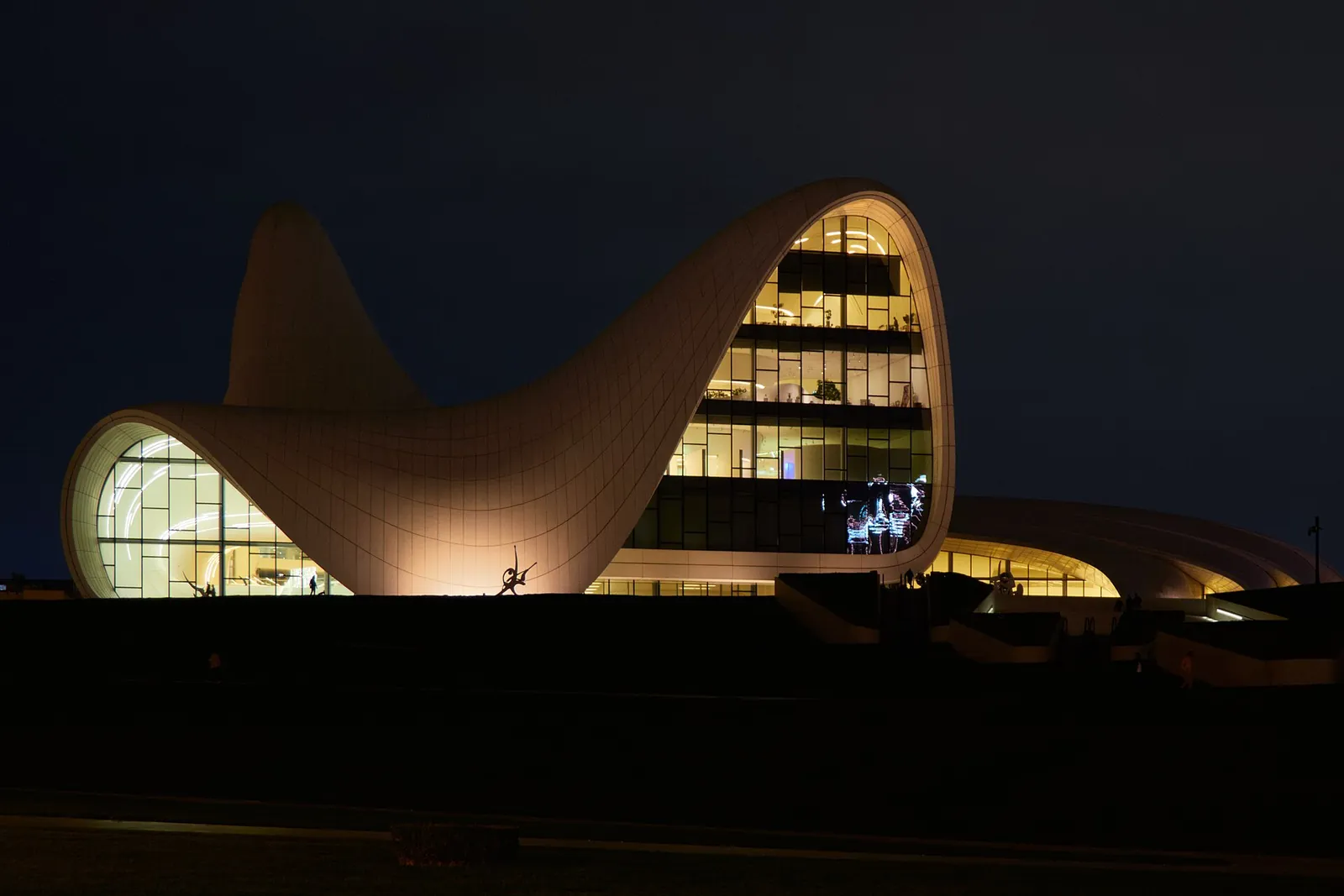 Heydar Aliyev Center's flowing curves glowing after dark