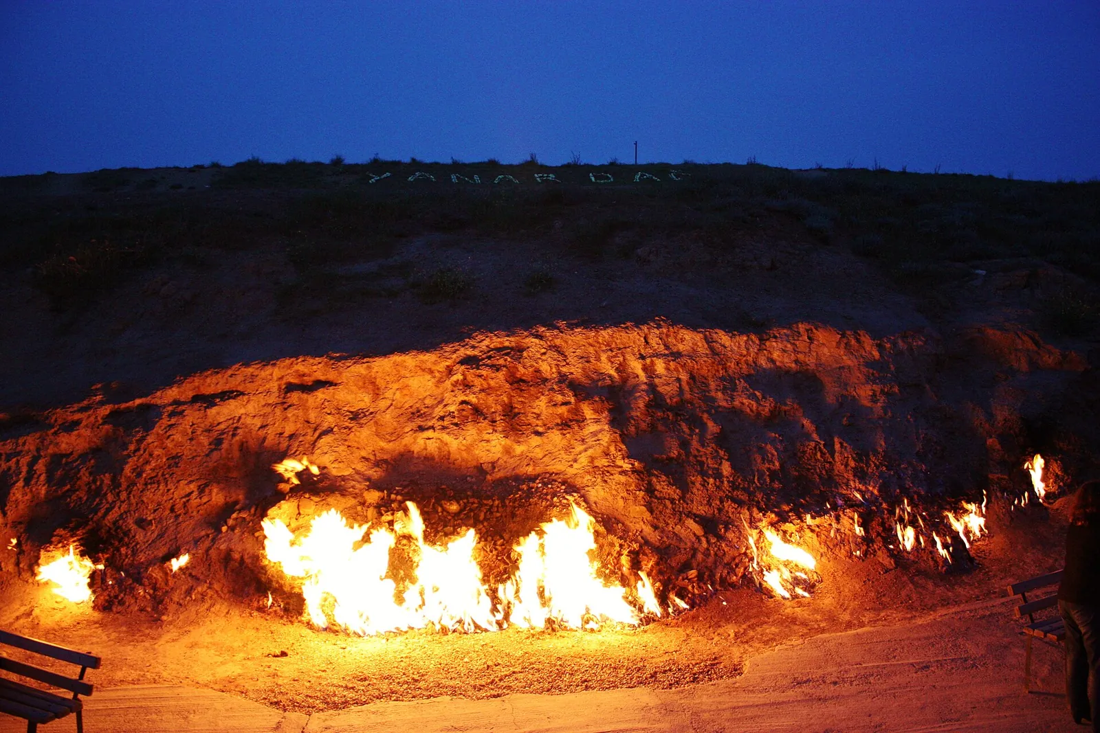 Flames dancing along the hillside at Yanardag at dusk