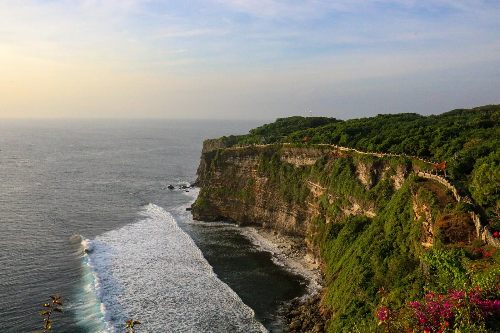 Uluwatu's sheer green cliffs above the Indian Ocean