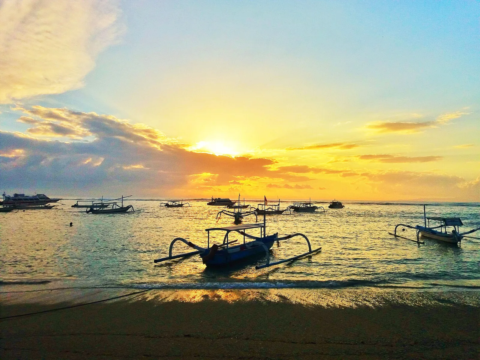 Sunrise over fishing boats on Sanur Beach