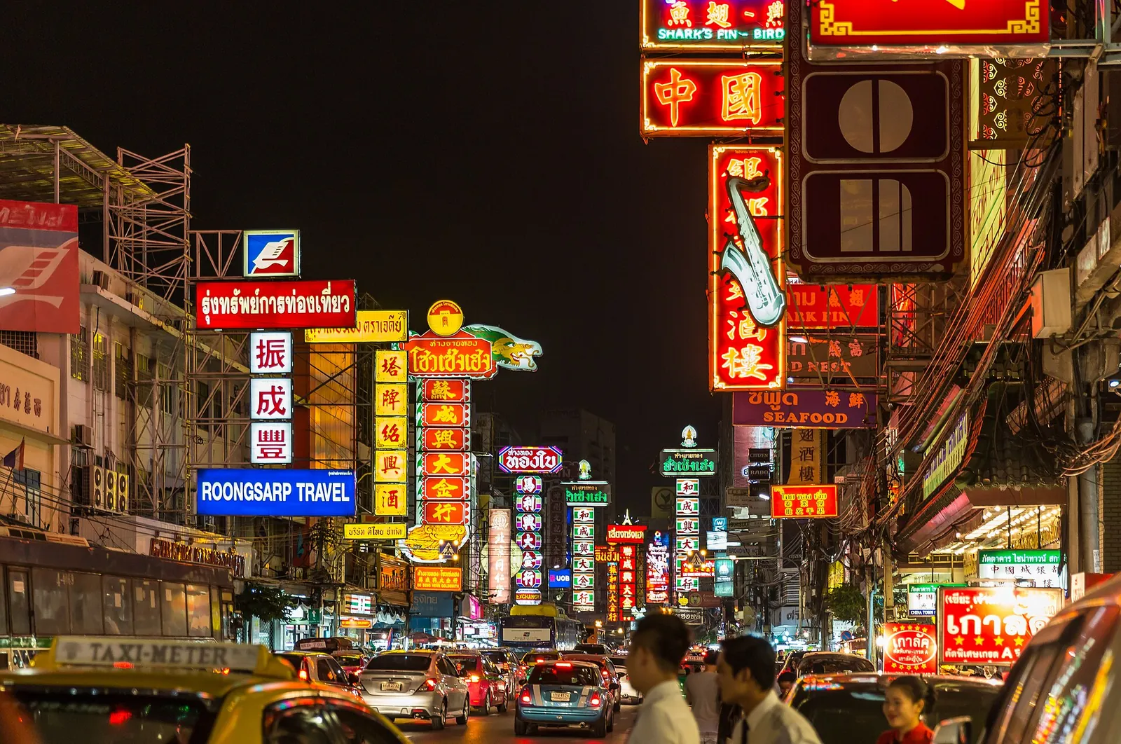 Neon signs lighting up Yaowarat Road in Chinatown