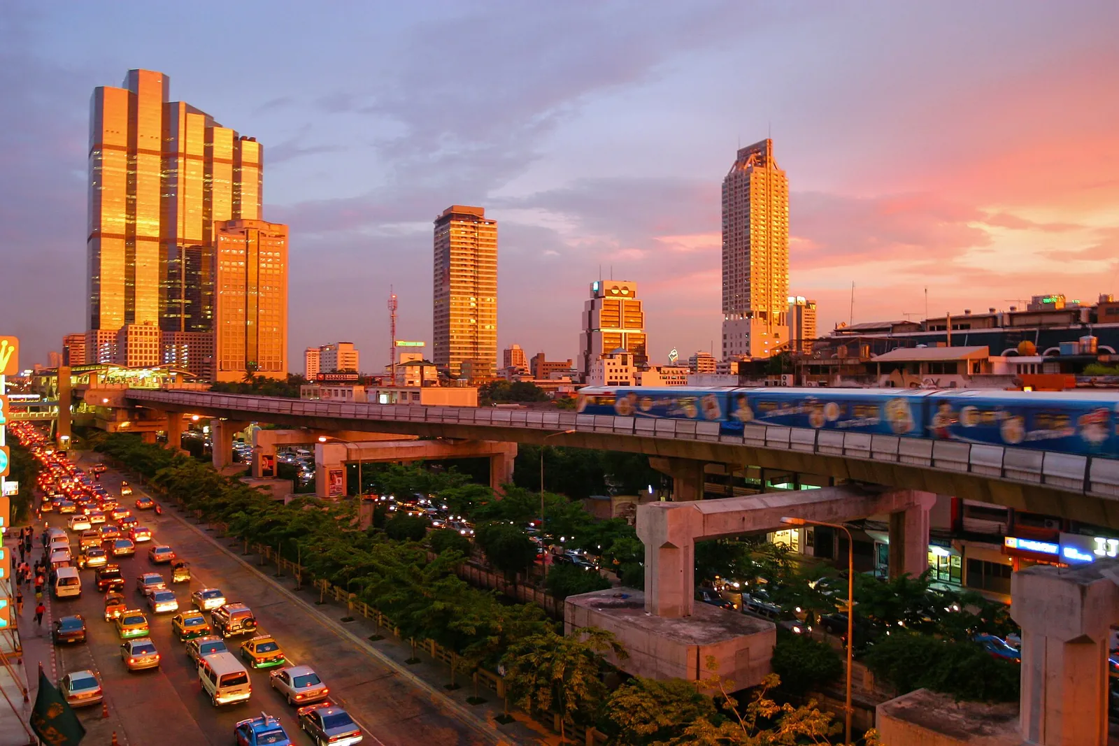 Golden sunset over Bangkok's towers and Skytrain
