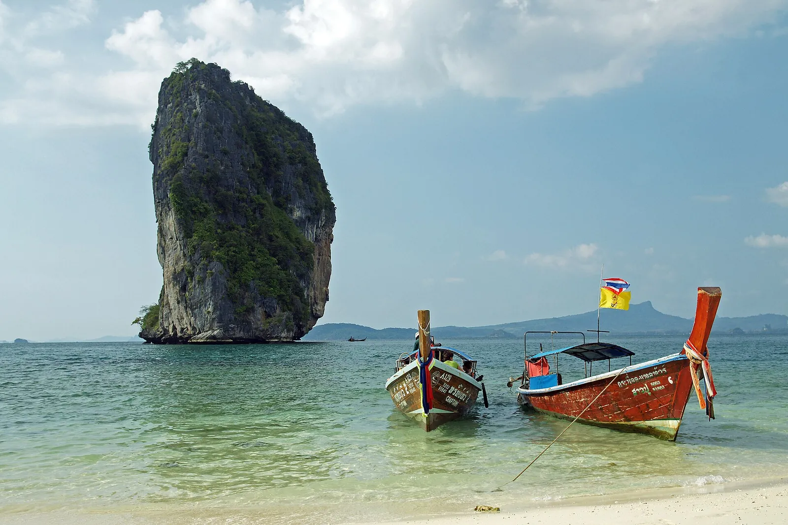 Koh Poda's rock tower and longtail boats