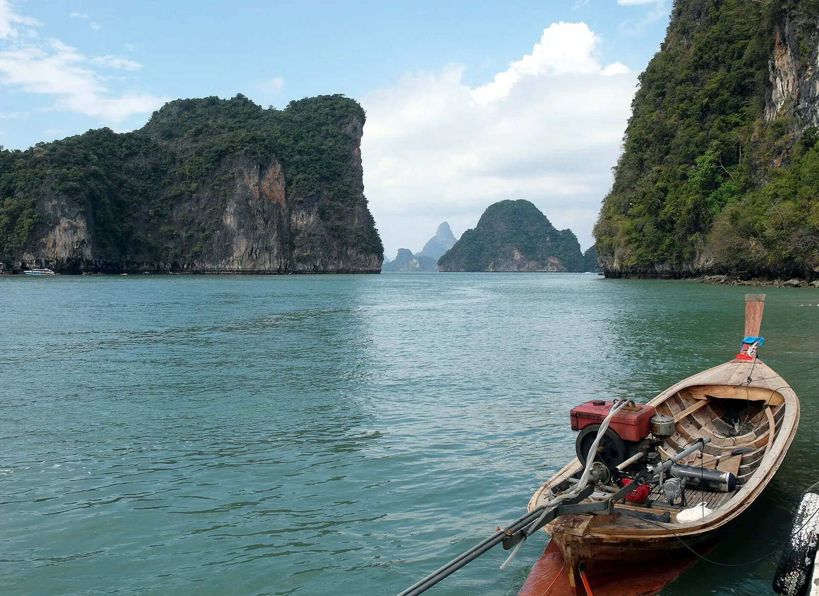 Longtail boat in the calm waters of the Hong Islands