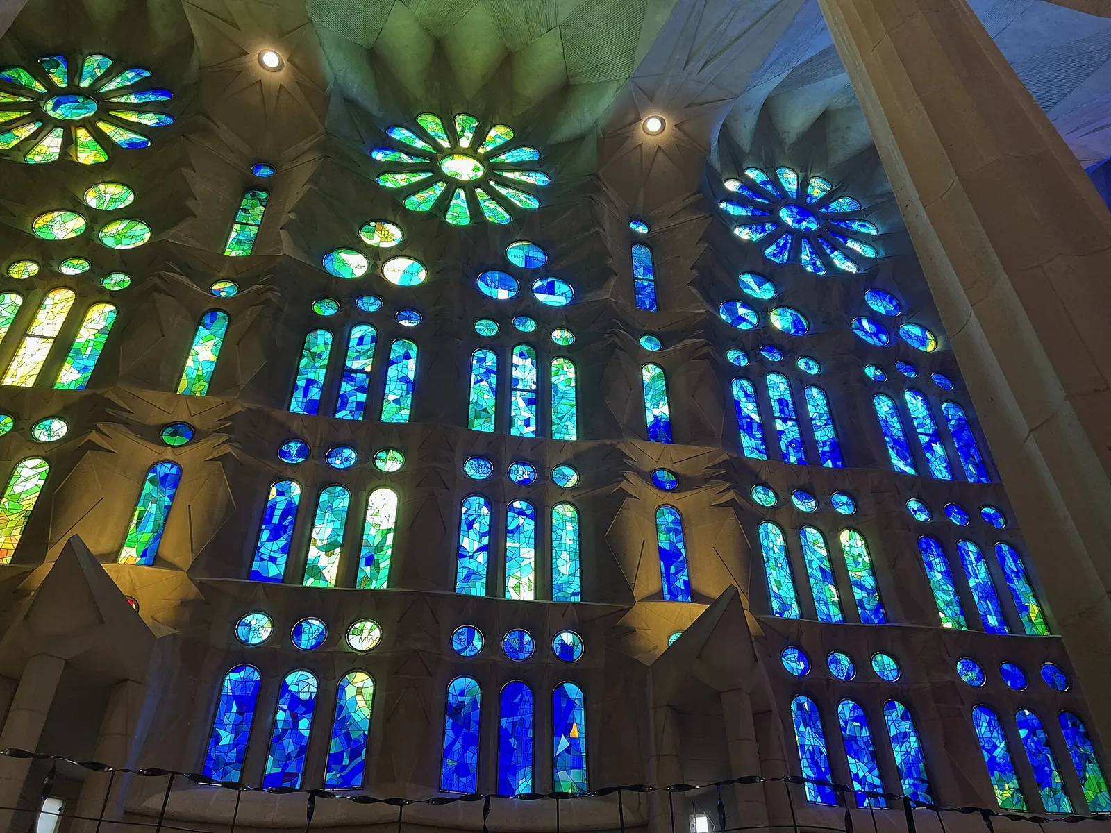 Blue and green stained glass inside the Sagrada Família