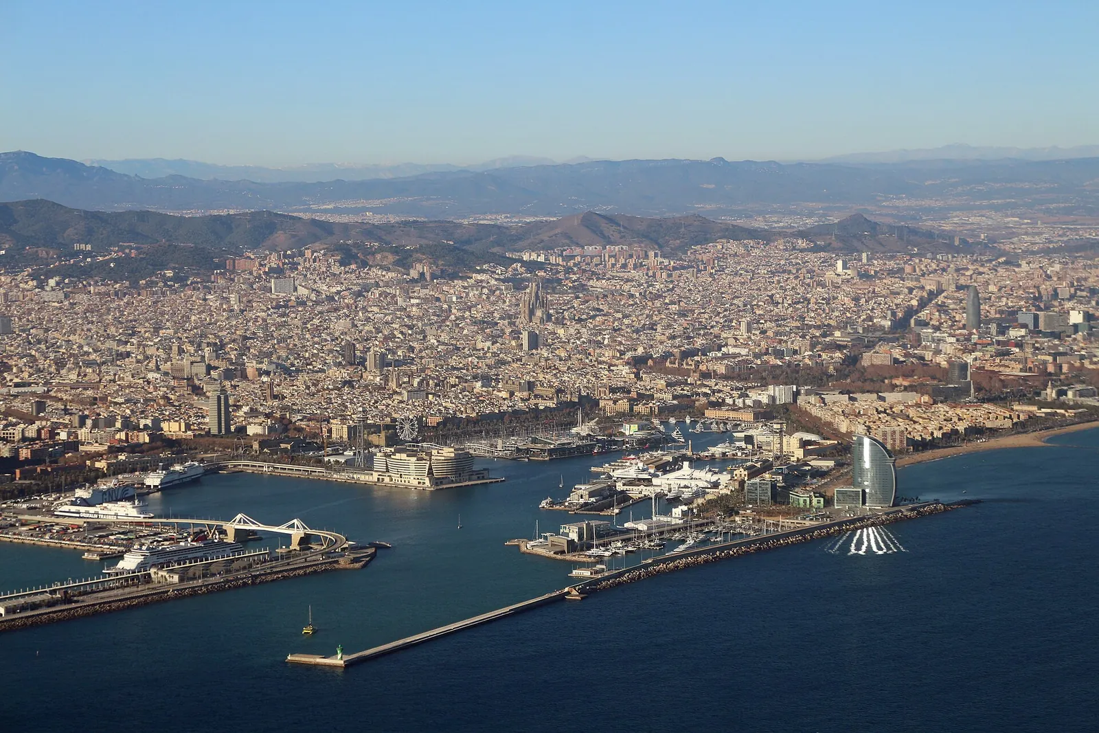 Aerial view of Barcelona's port, beaches and city grid
