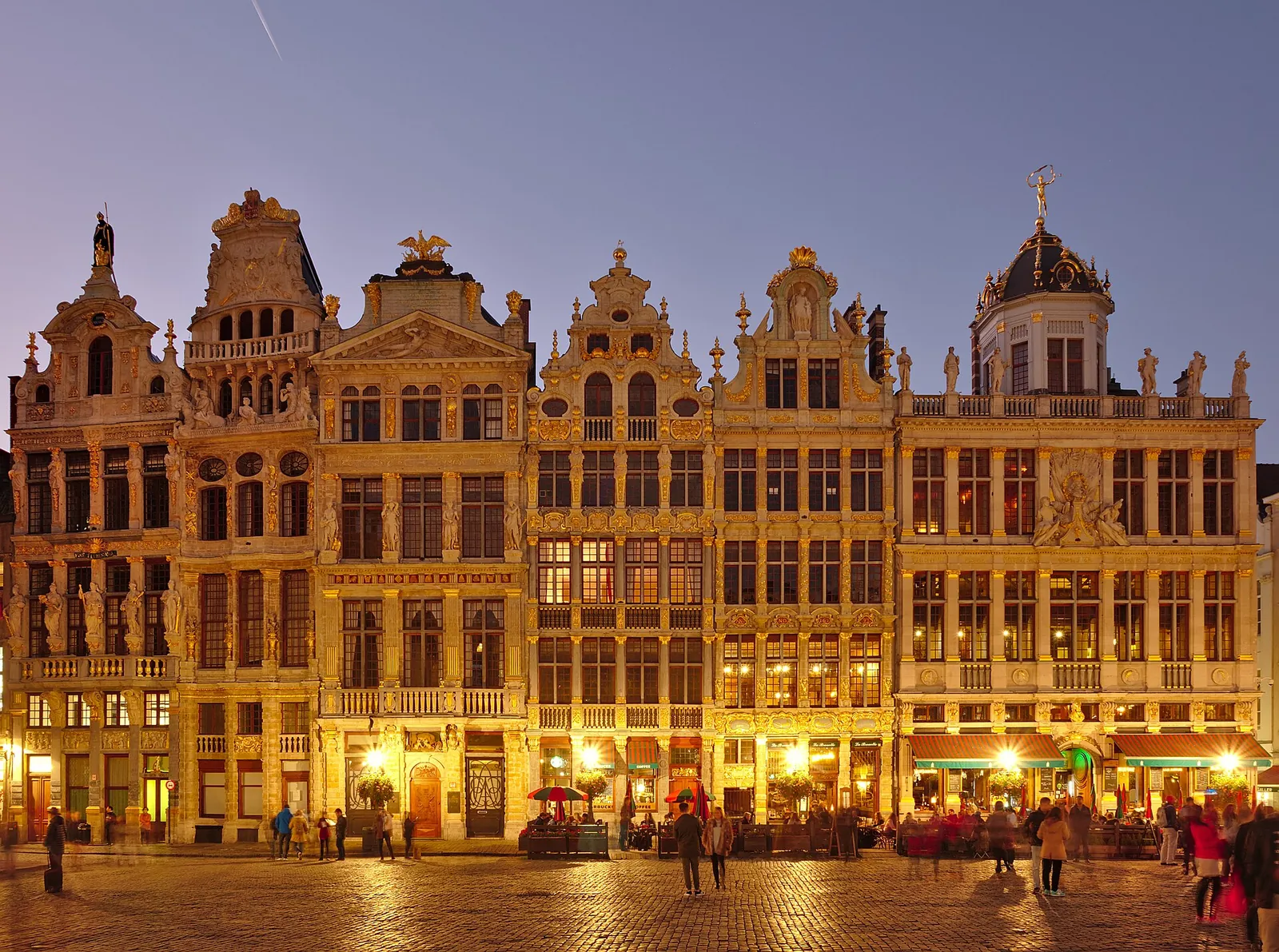 Guild houses of the Grand-Place lit up at twilight