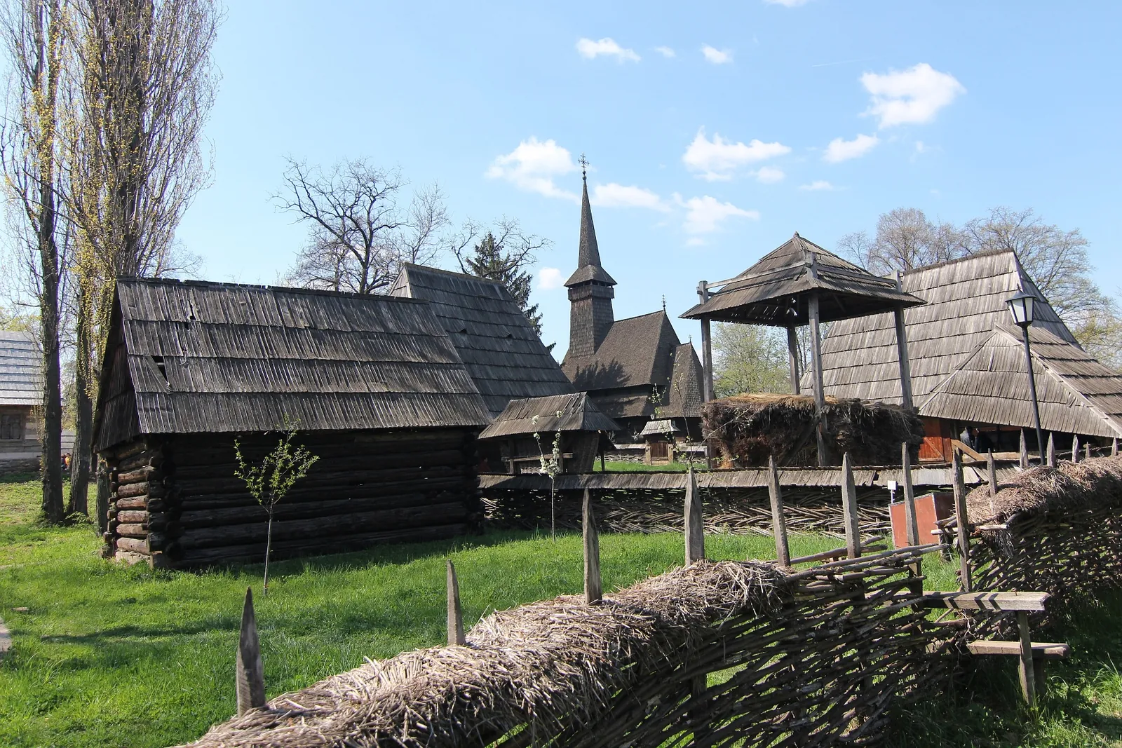 Wooden houses and church at the National Village Museum