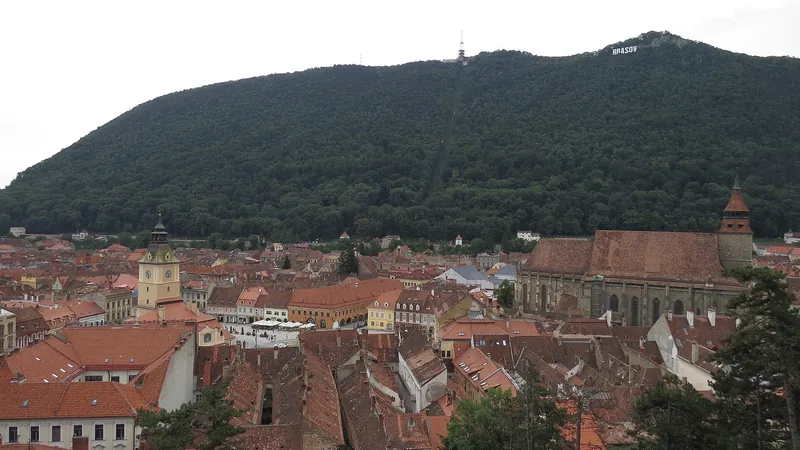 Brașov's red roofs and Black Church below Mount Tâmpa