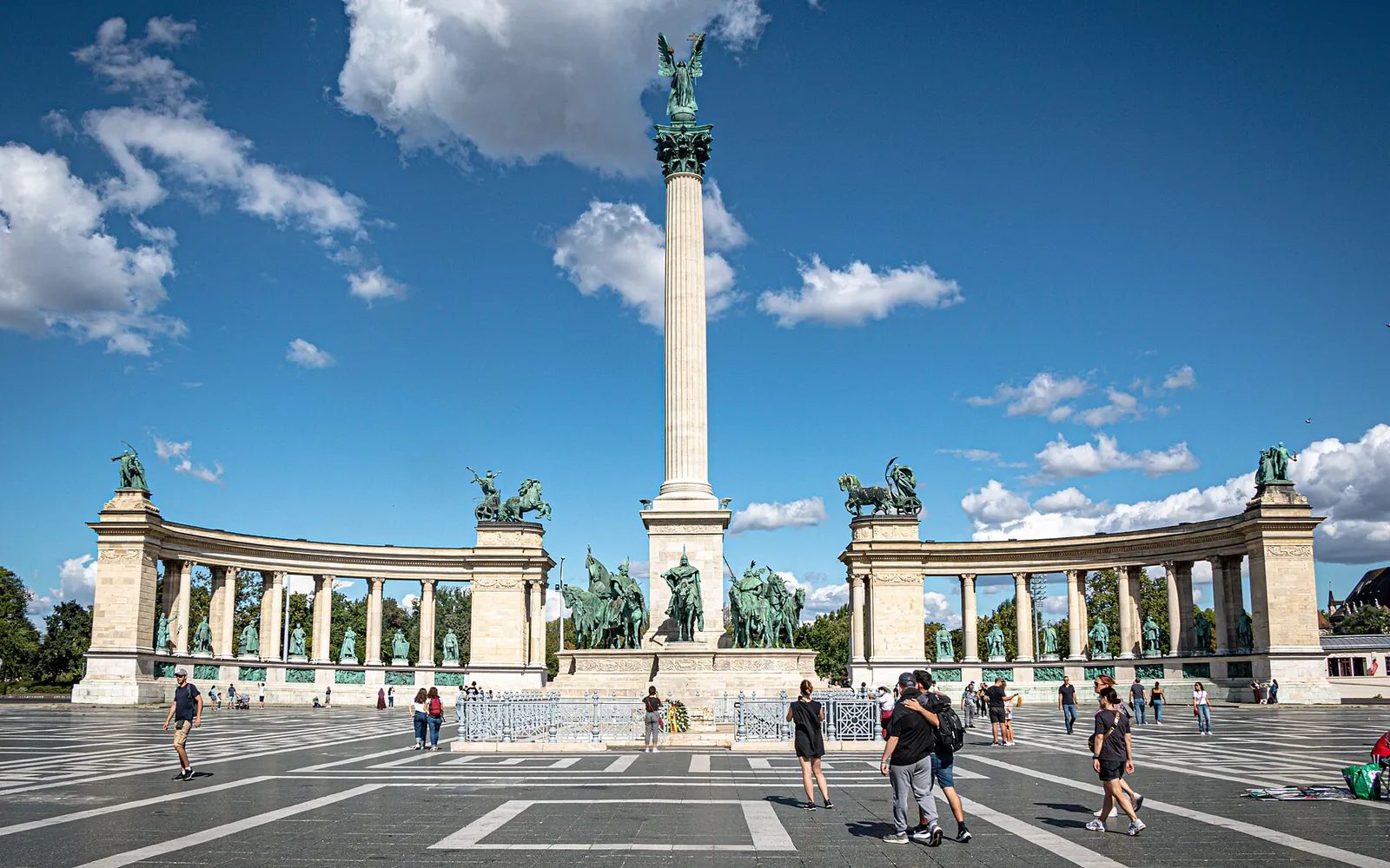 Millennium monument on Heroes' Square under summer clouds