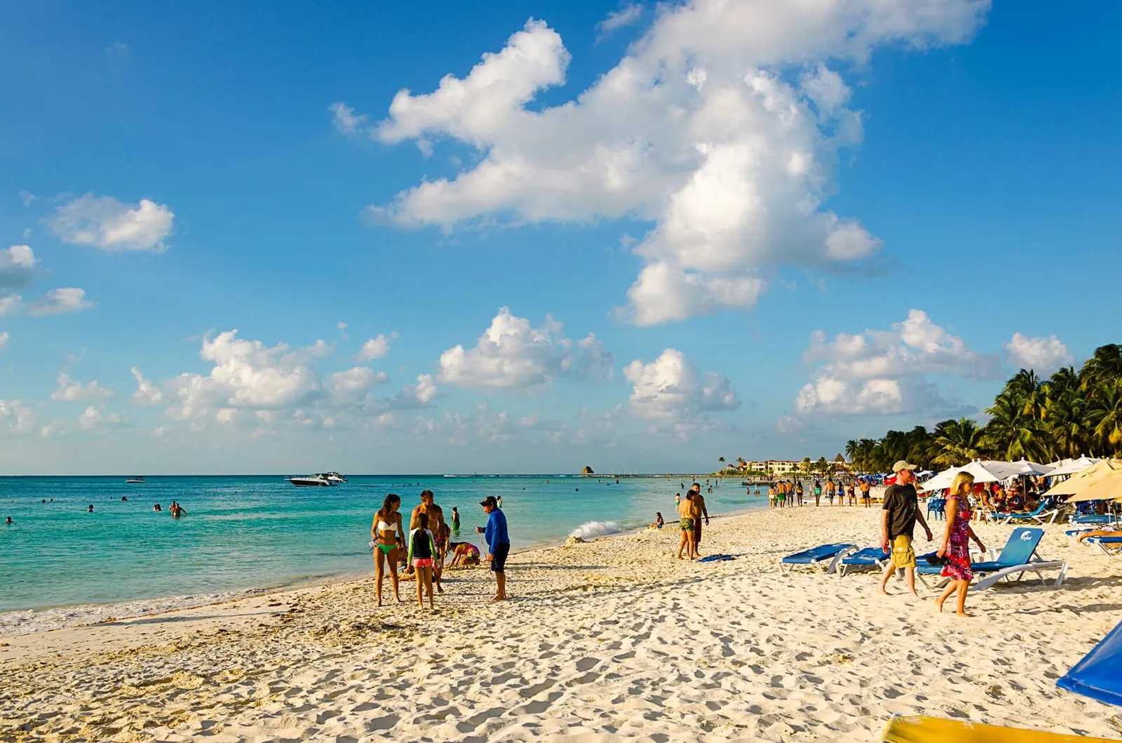 Sunbathers on a bright white beach on Isla Mujeres