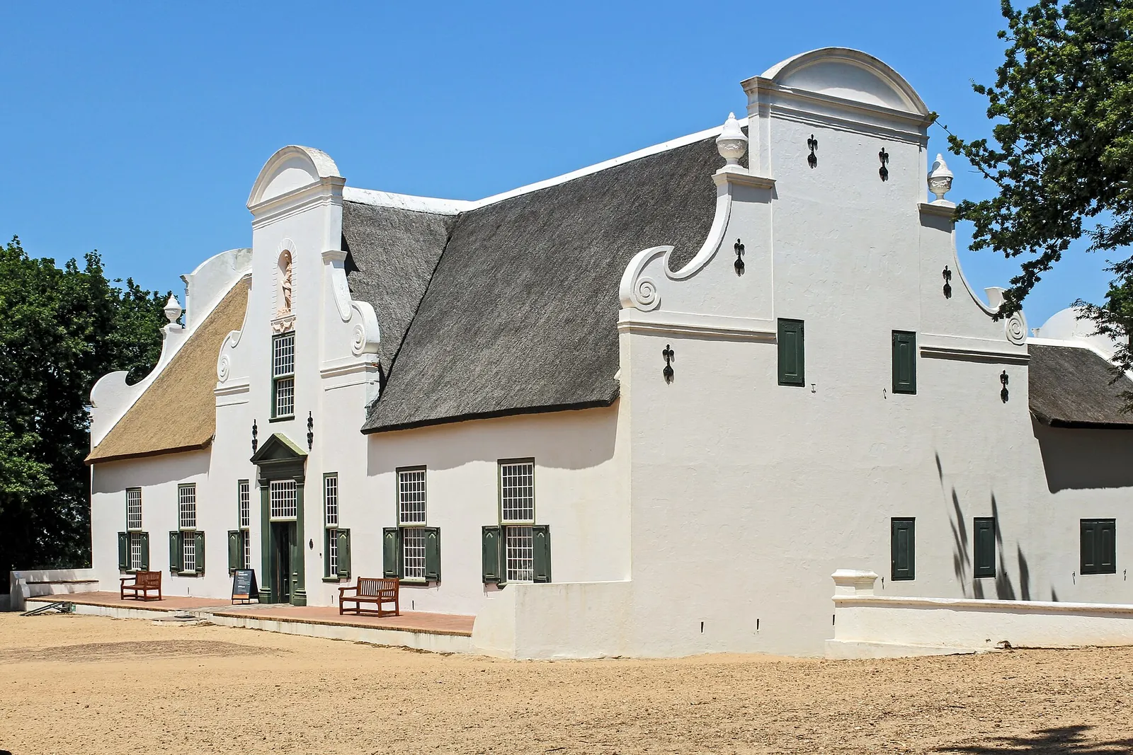 The gabled Groot Constantia homestead in the sunshine