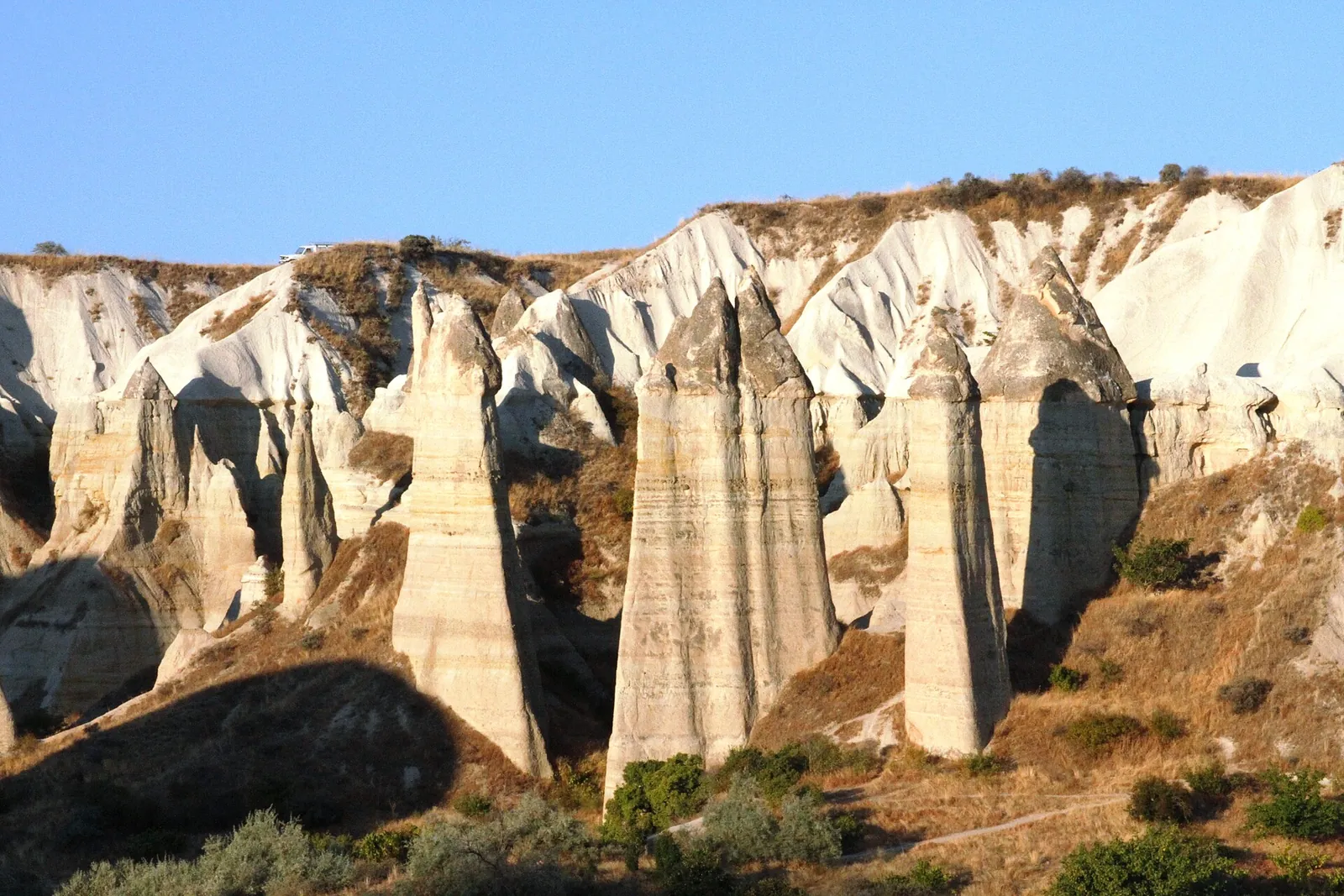 Tall rock pillars of Love Valley in golden light