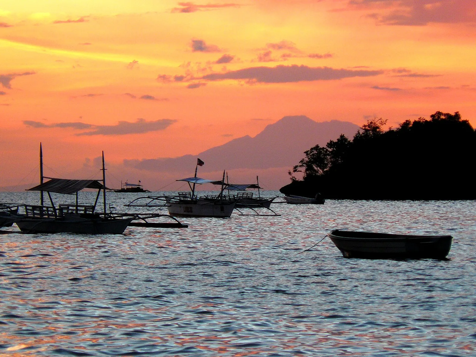 Bangka boats at sunset off Alona Beach, Panglao