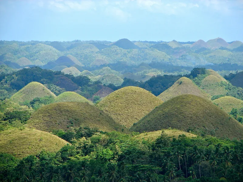 Rolling green Chocolate Hills under a blue sky, Bohol