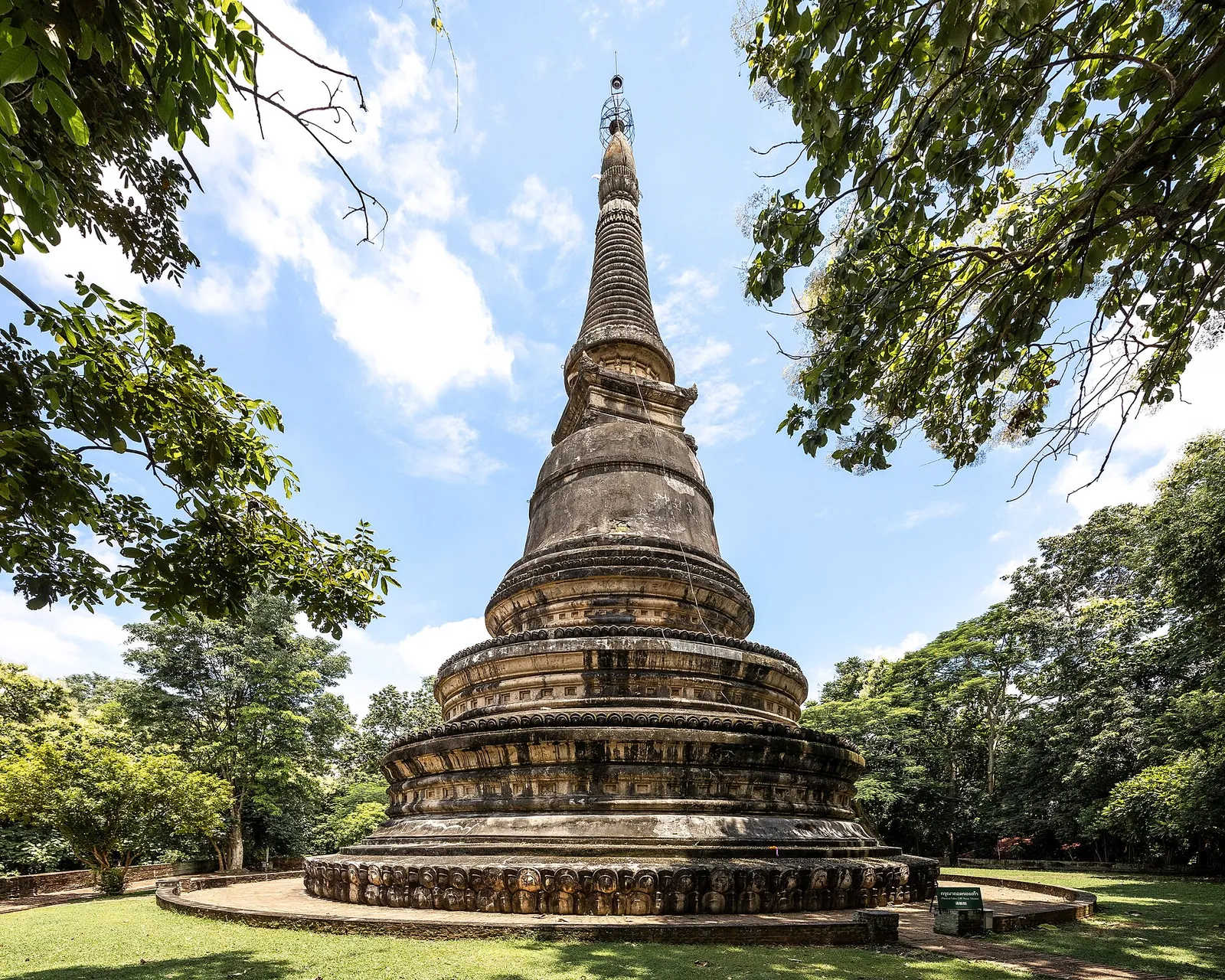 An old chedi among shady trees at Wat Umong