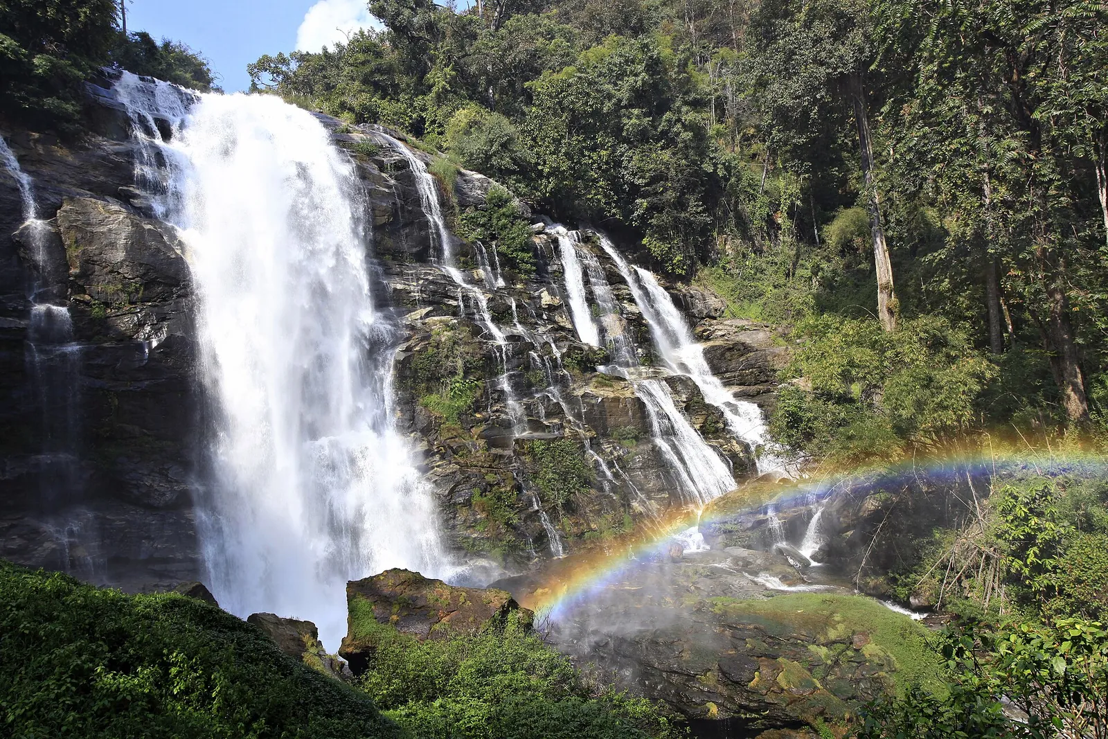 Wachirathan waterfall with a rainbow in the spray