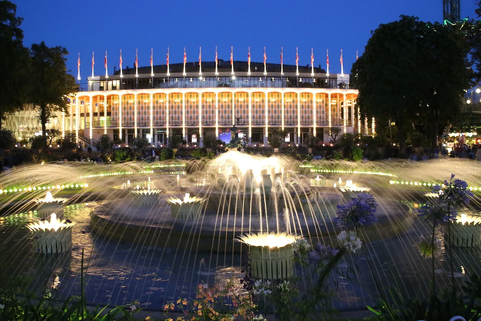 Tivoli Gardens fountains and lights at dusk