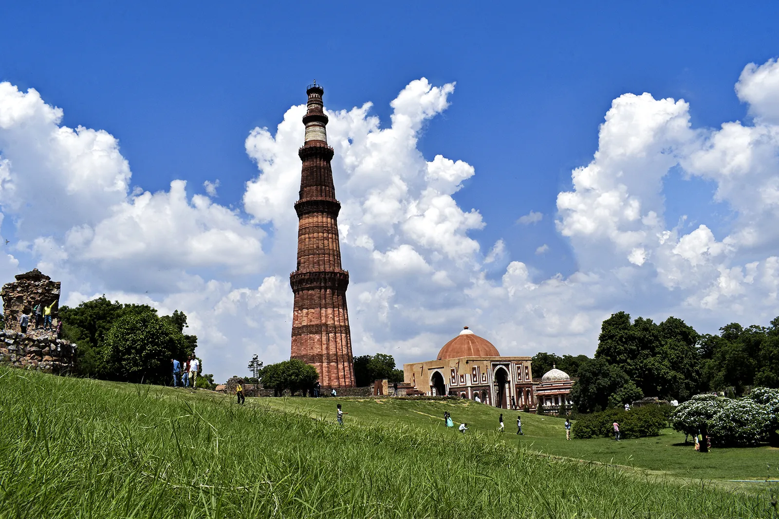 Qutb Minar rising against a bright blue sky in Delhi