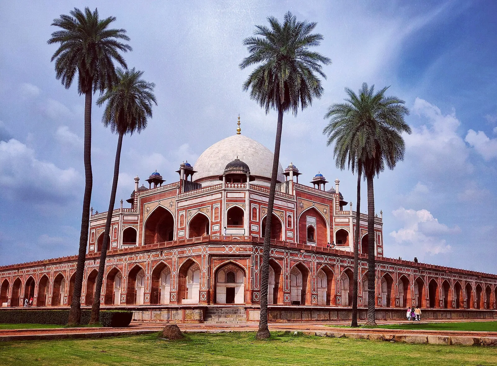 Humayun's Tomb framed by tall palm trees