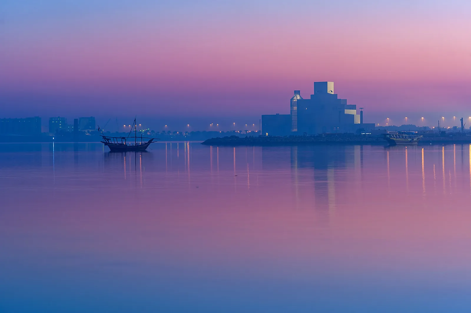 The Museum of Islamic Art across the bay at pink dusk