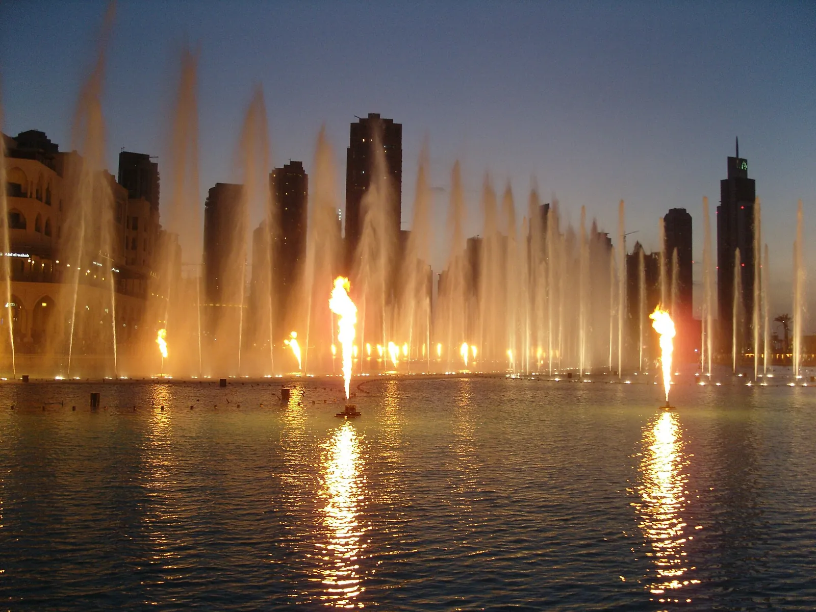 The Dubai Fountain dancing at dusk in Downtown