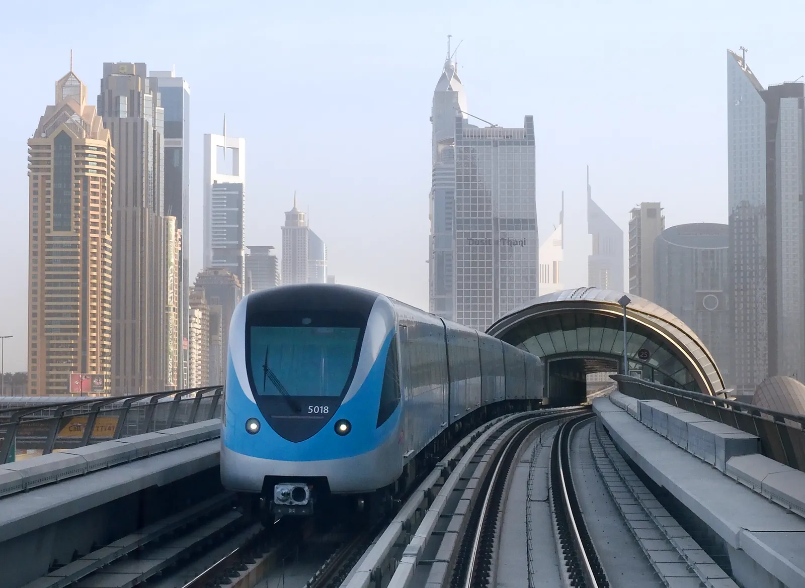 Dubai Metro train gliding past the city towers