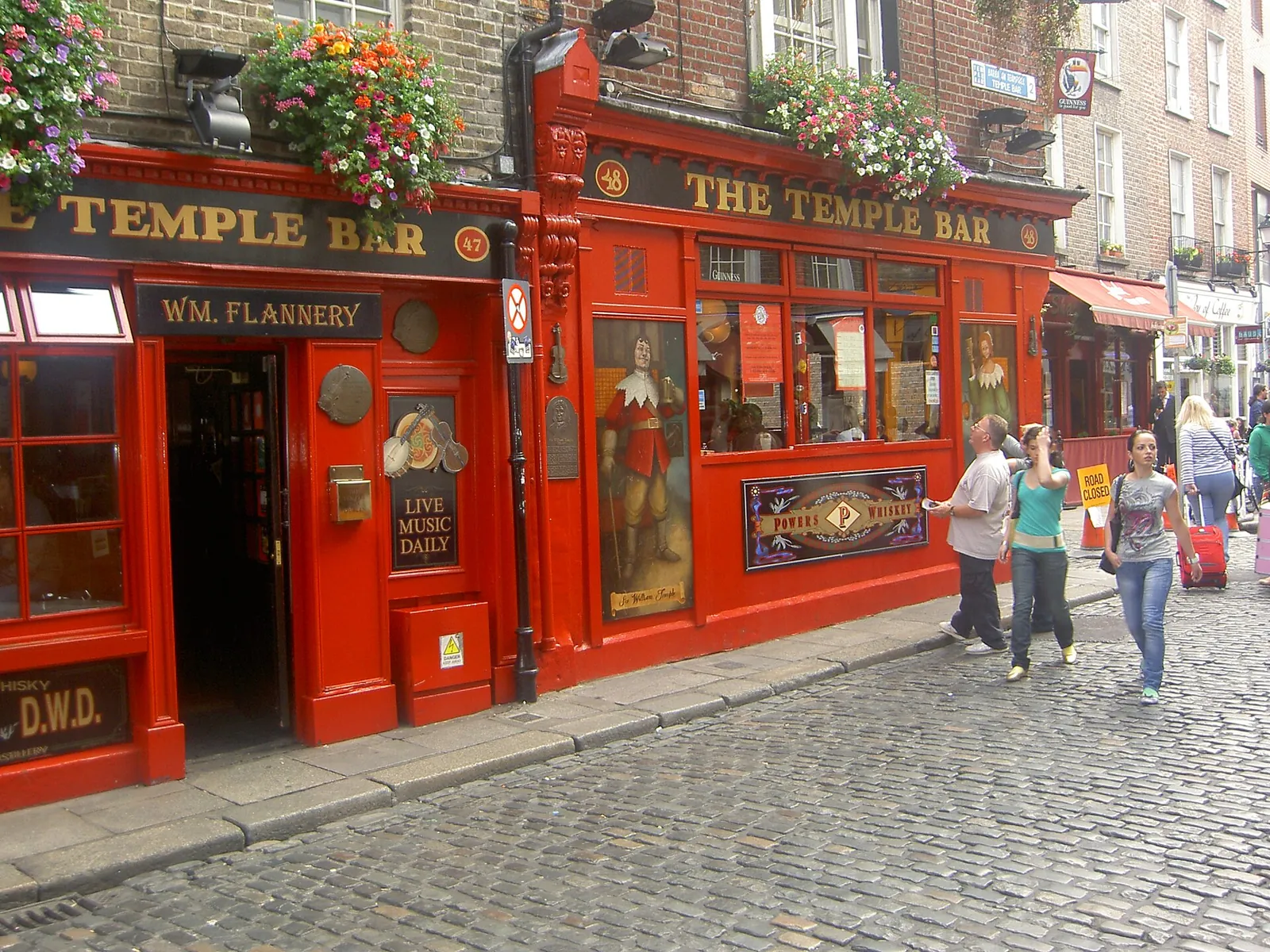 The red Temple Bar pub on a cobbled lane