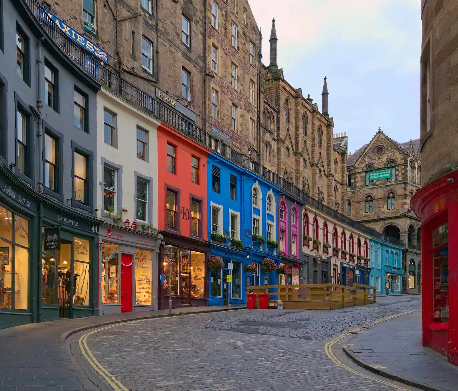 Colourful shopfronts curving down Victoria Street