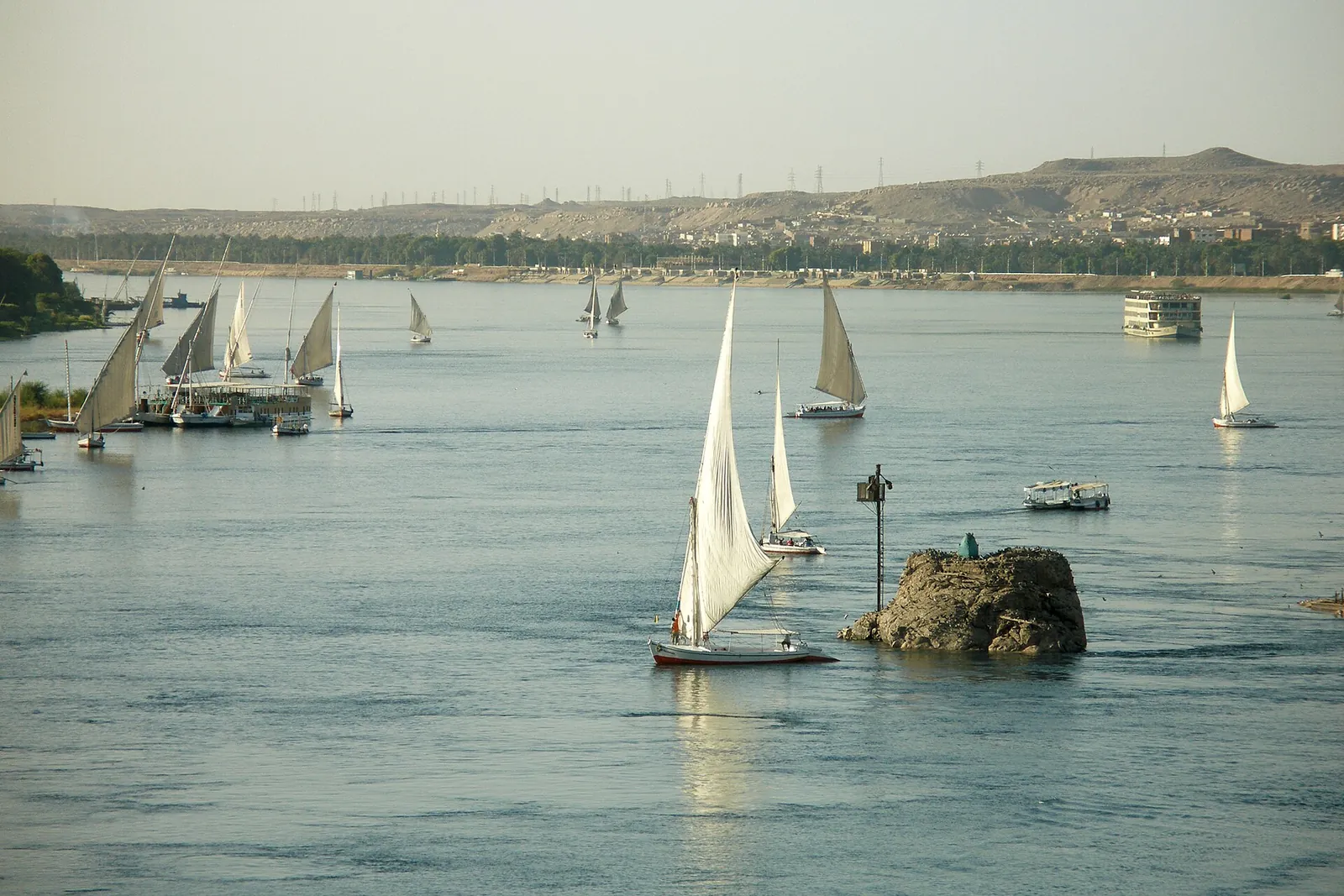 White-sailed feluccas on the Nile at Aswan