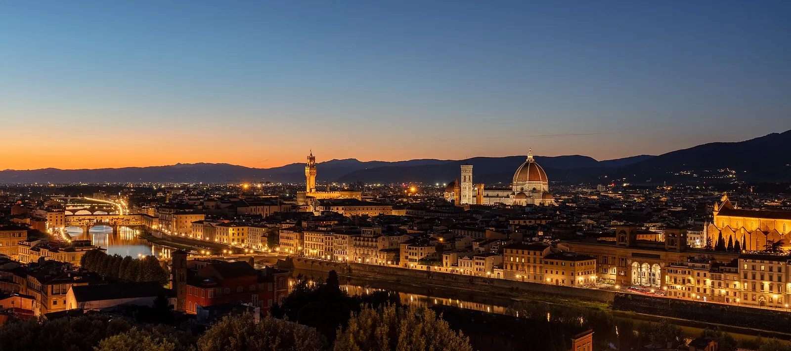 Florence glittering at twilight from Piazzale Michelangelo