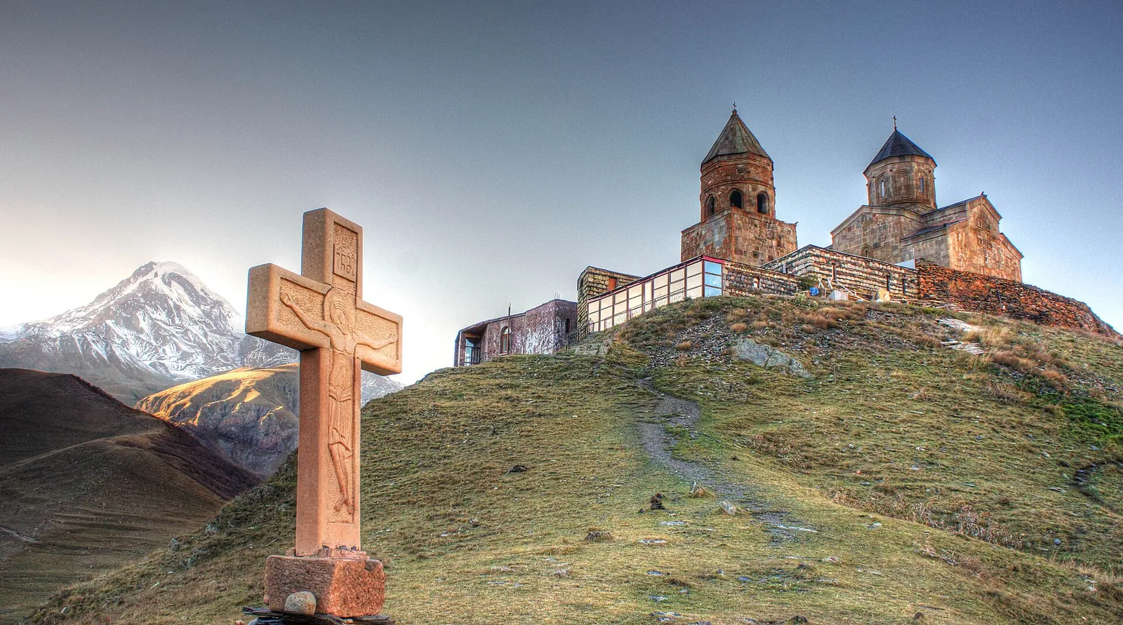 Gergeti Trinity Church on its green ridge