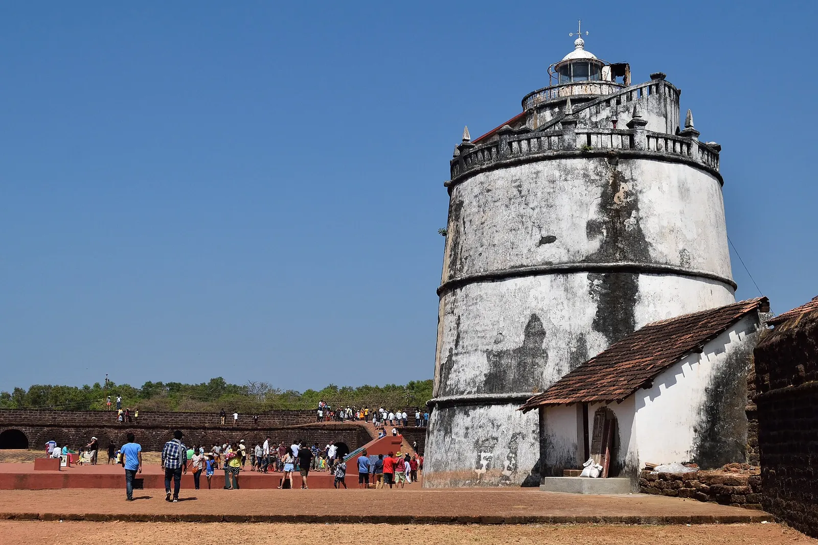 The old lighthouse at Fort Aguada on a sunny day