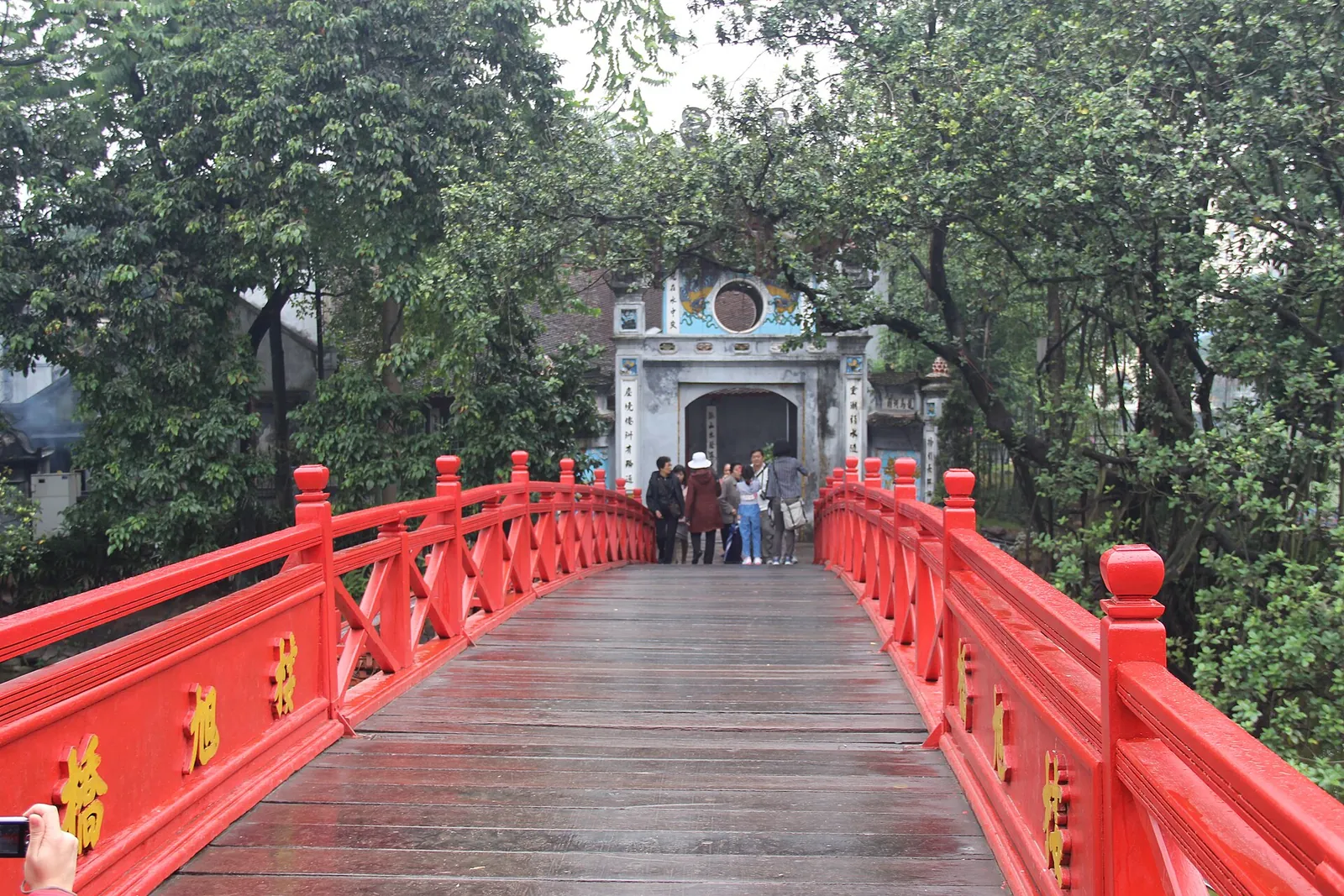 The red wooden bridge leading to Ngoc Son Temple