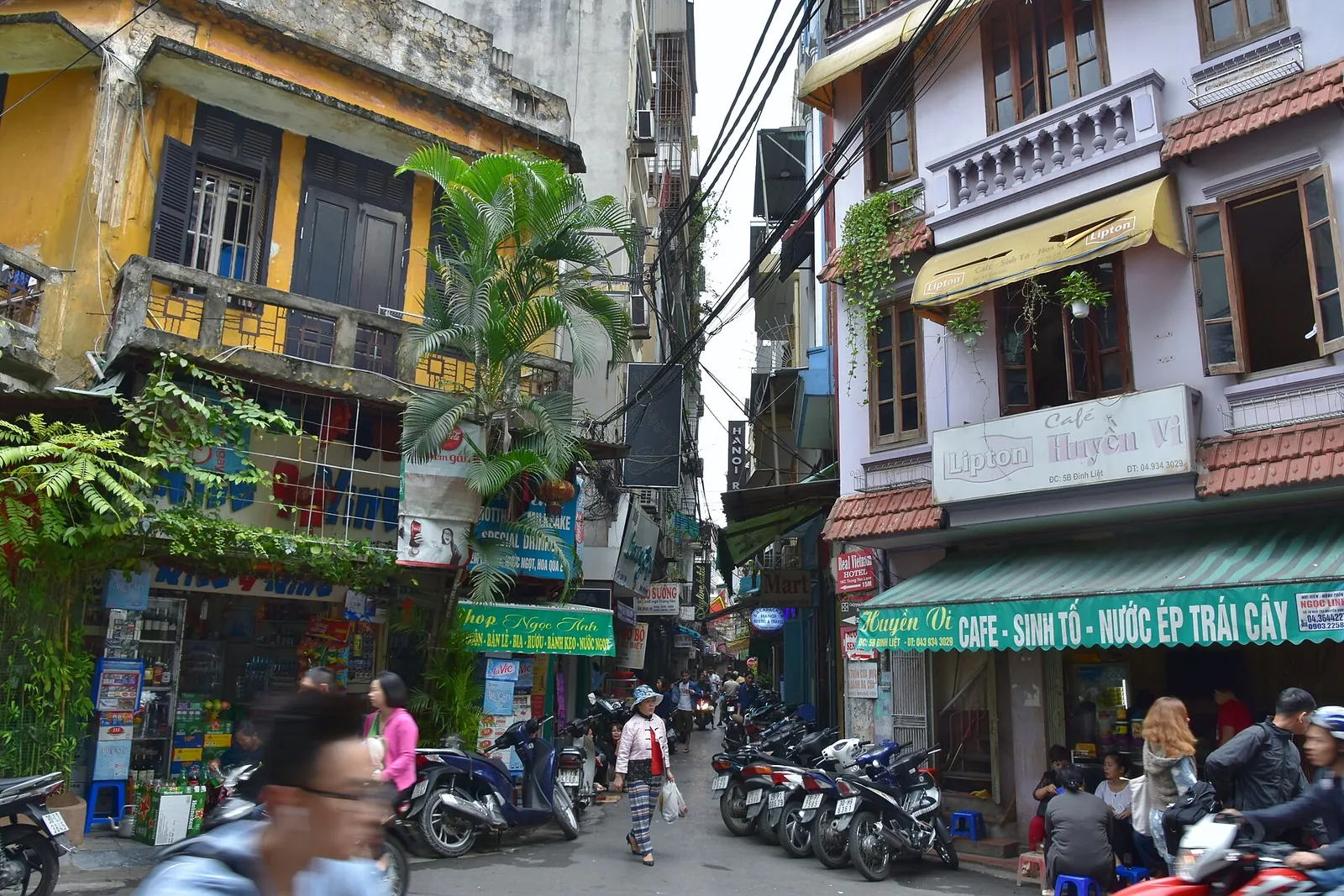 Colourful shophouses and cafes on an Old Quarter street