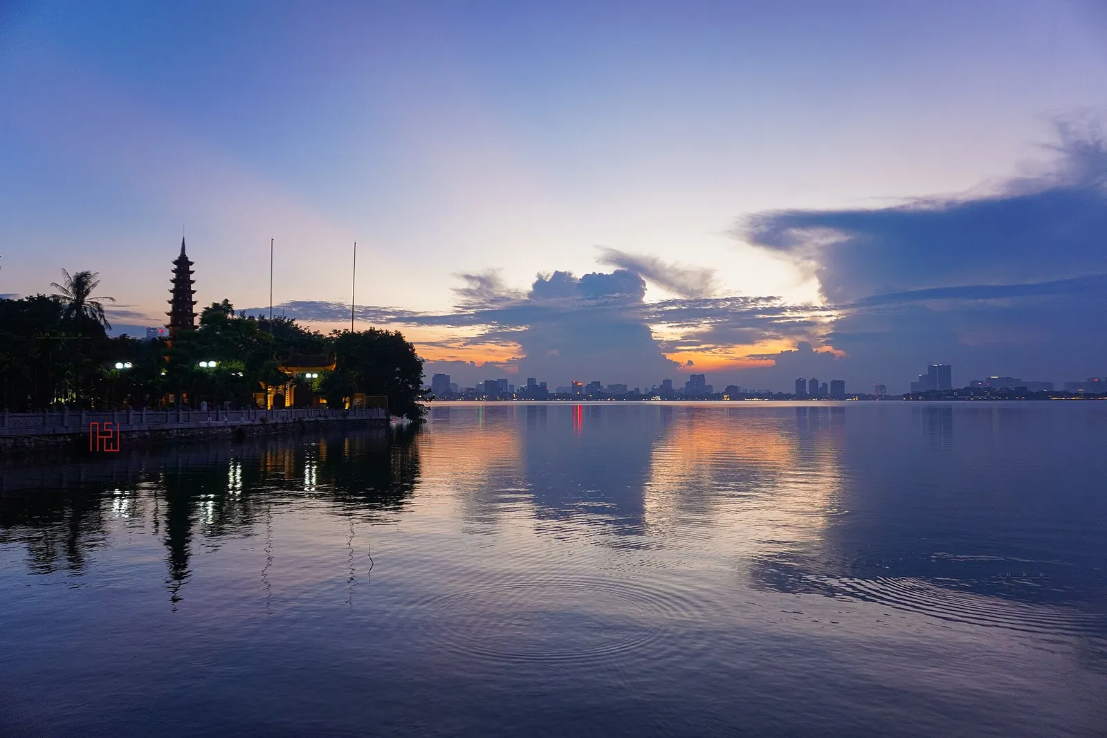 Dusk over West Lake with Tran Quoc Pagoda on the shore