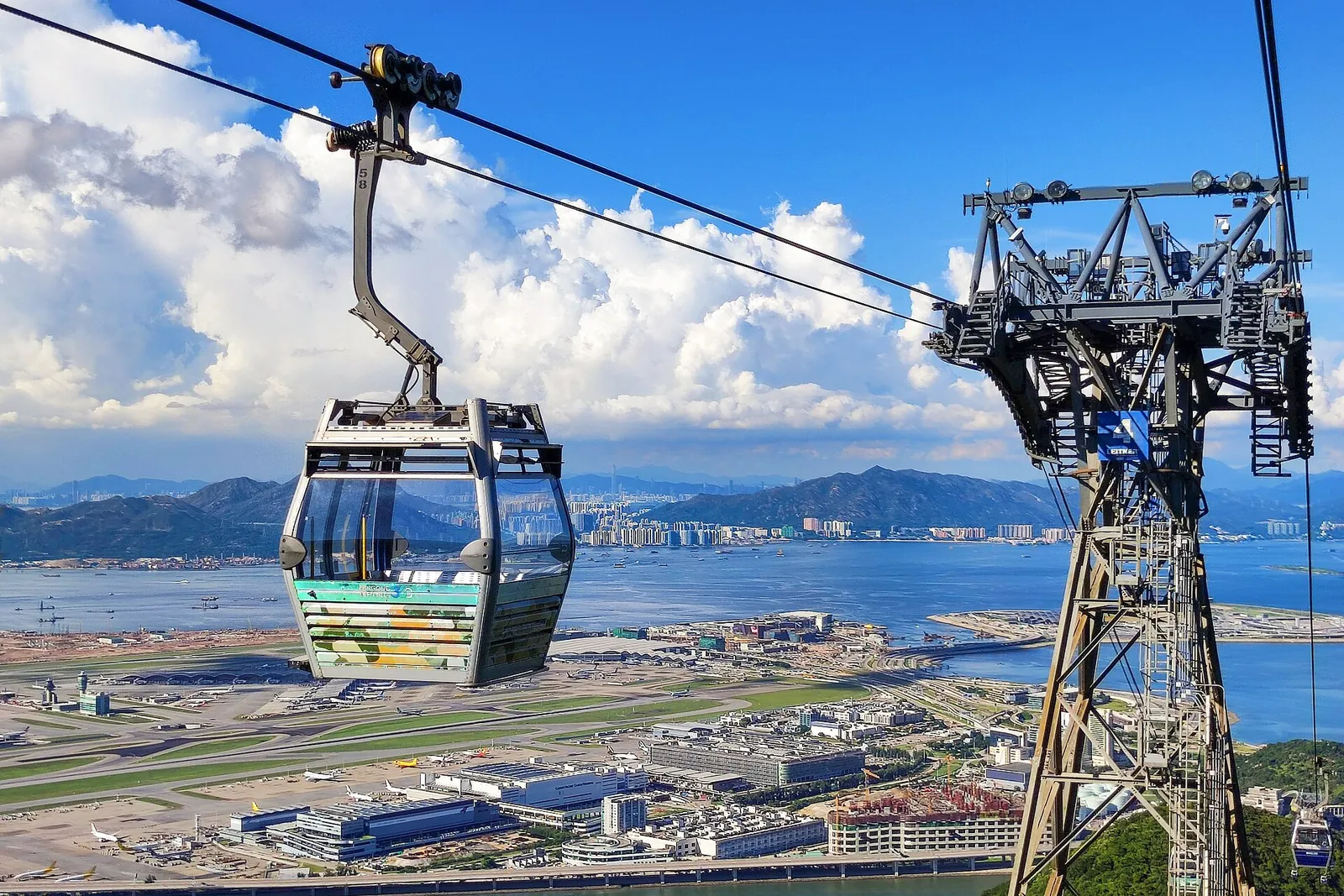 Ngong Ping 360 cabin gliding above Lantau's coast