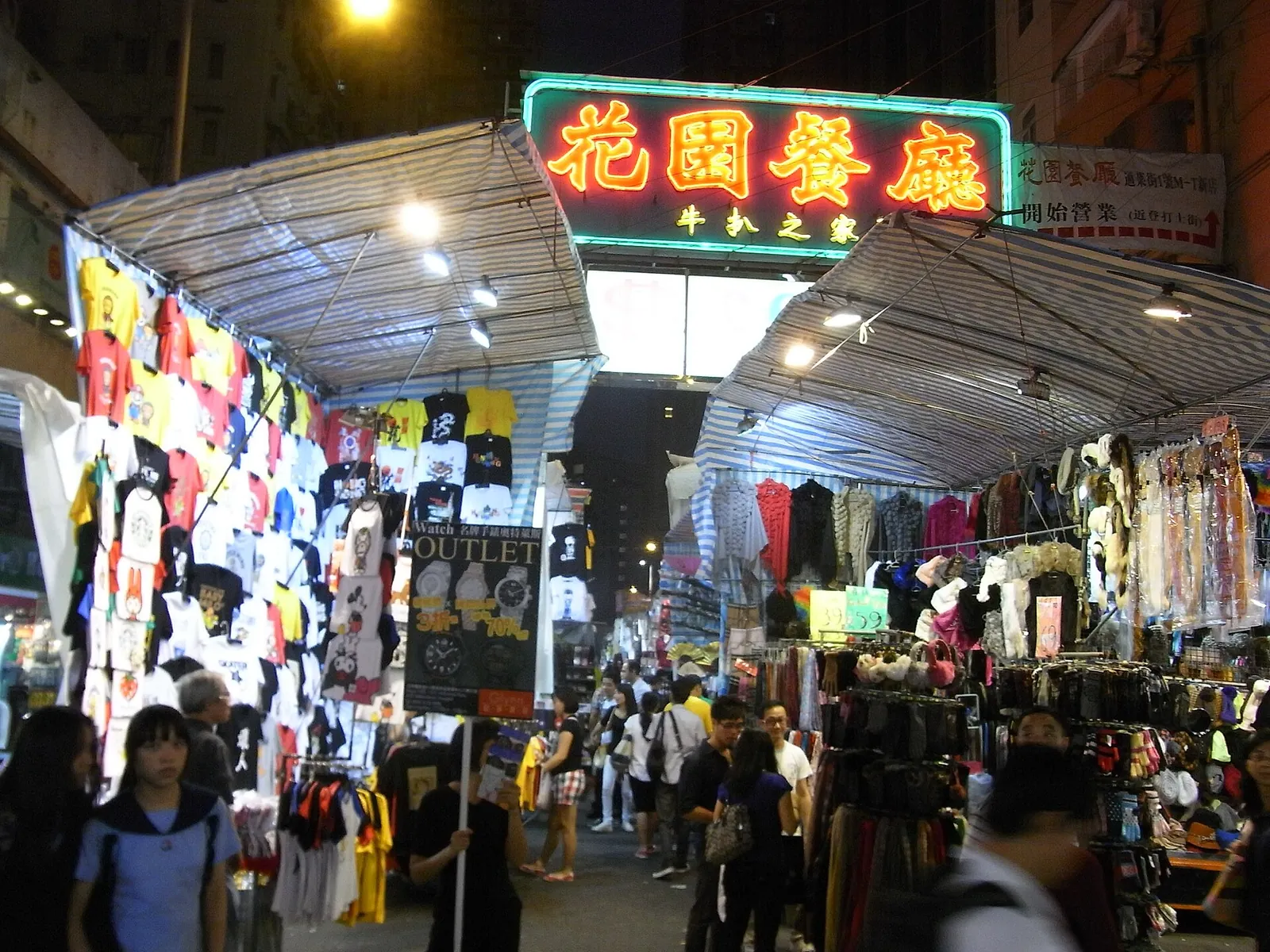 Neon signs and stalls in Mong Kok at night