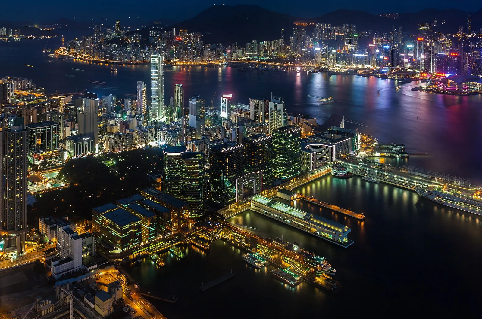 Kowloon and Victoria Harbour lit up after dark