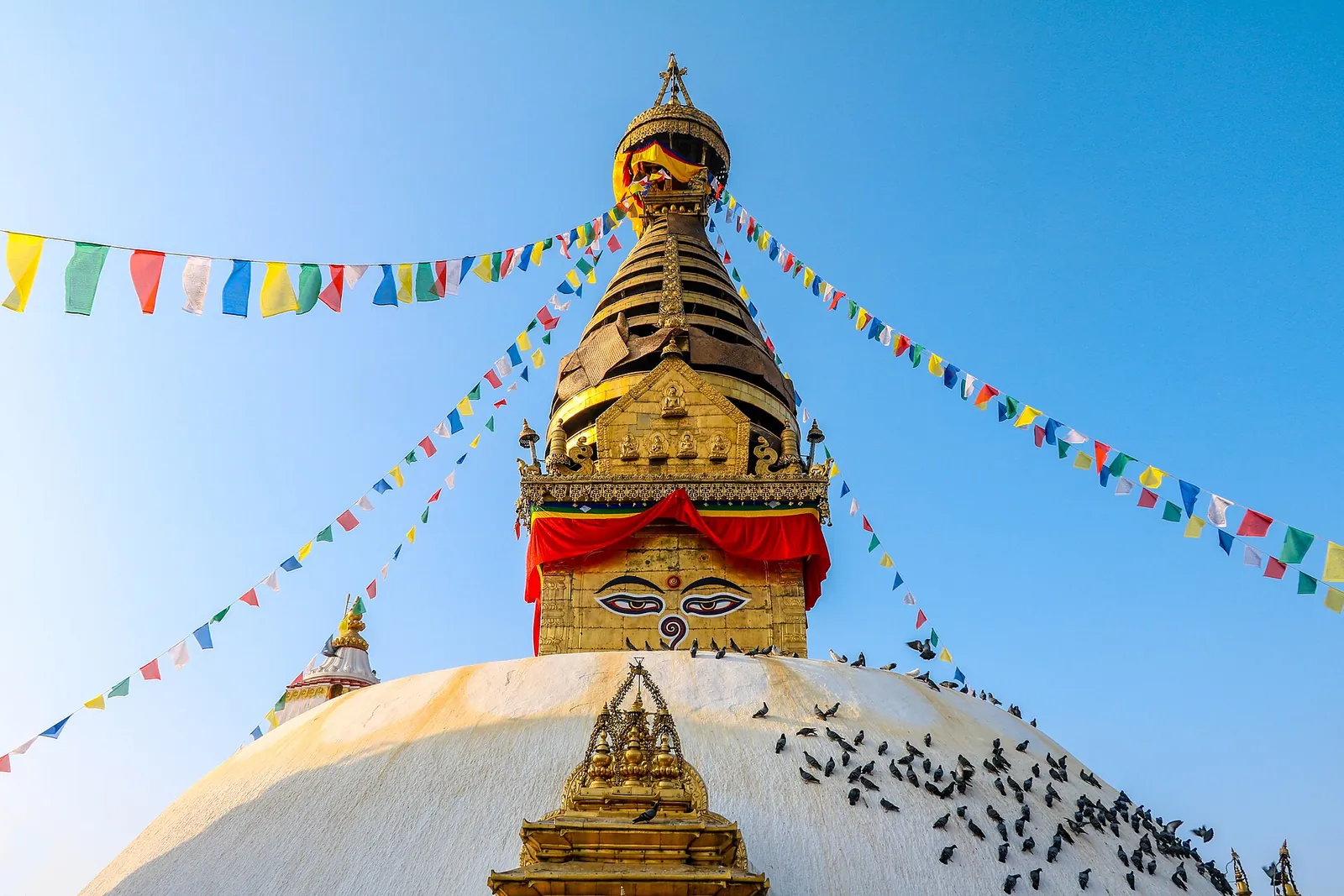 Swayambhu Stupa's golden spire and painted Buddha eyes