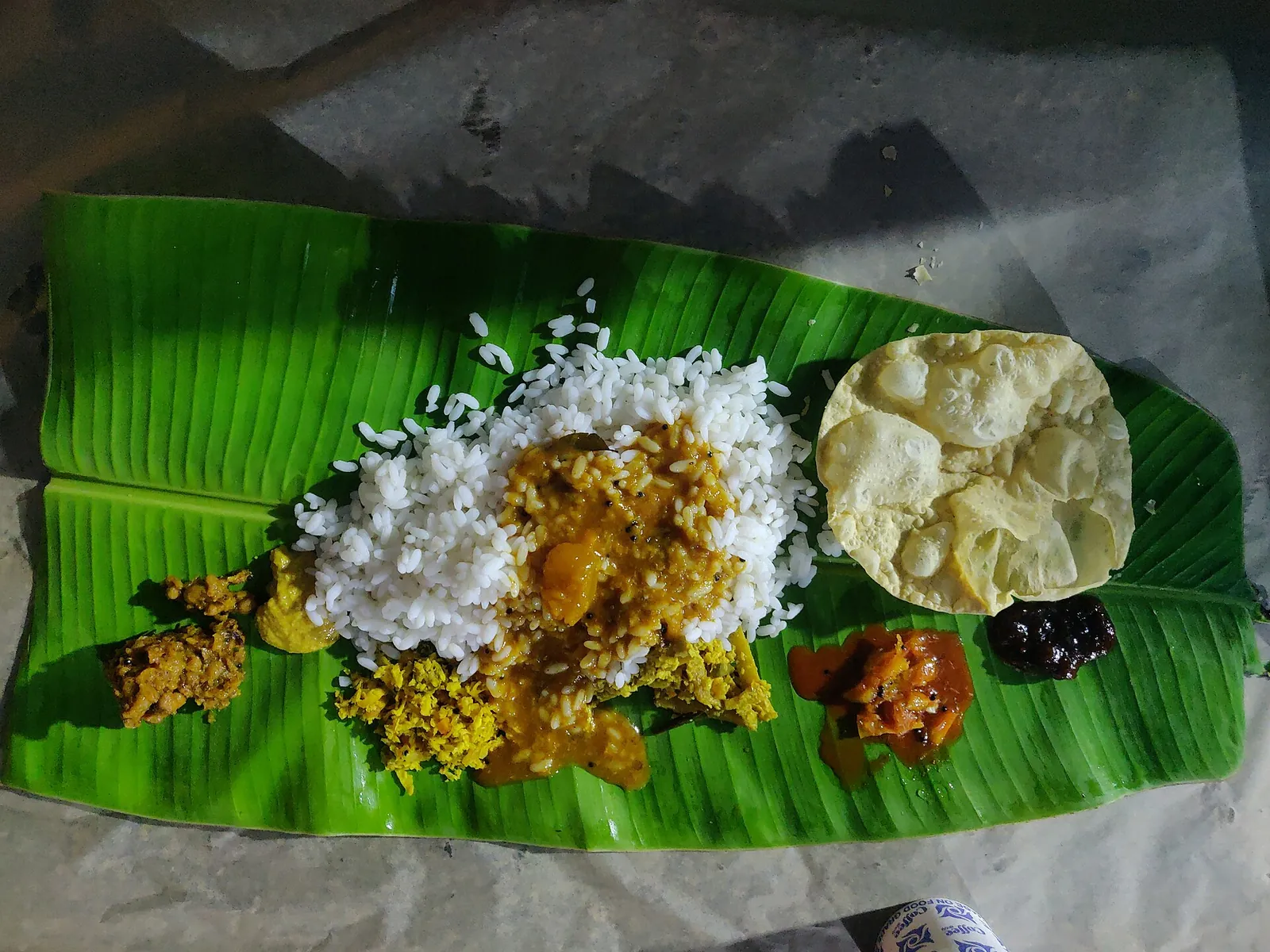 Kerala sadya meal served on a banana leaf