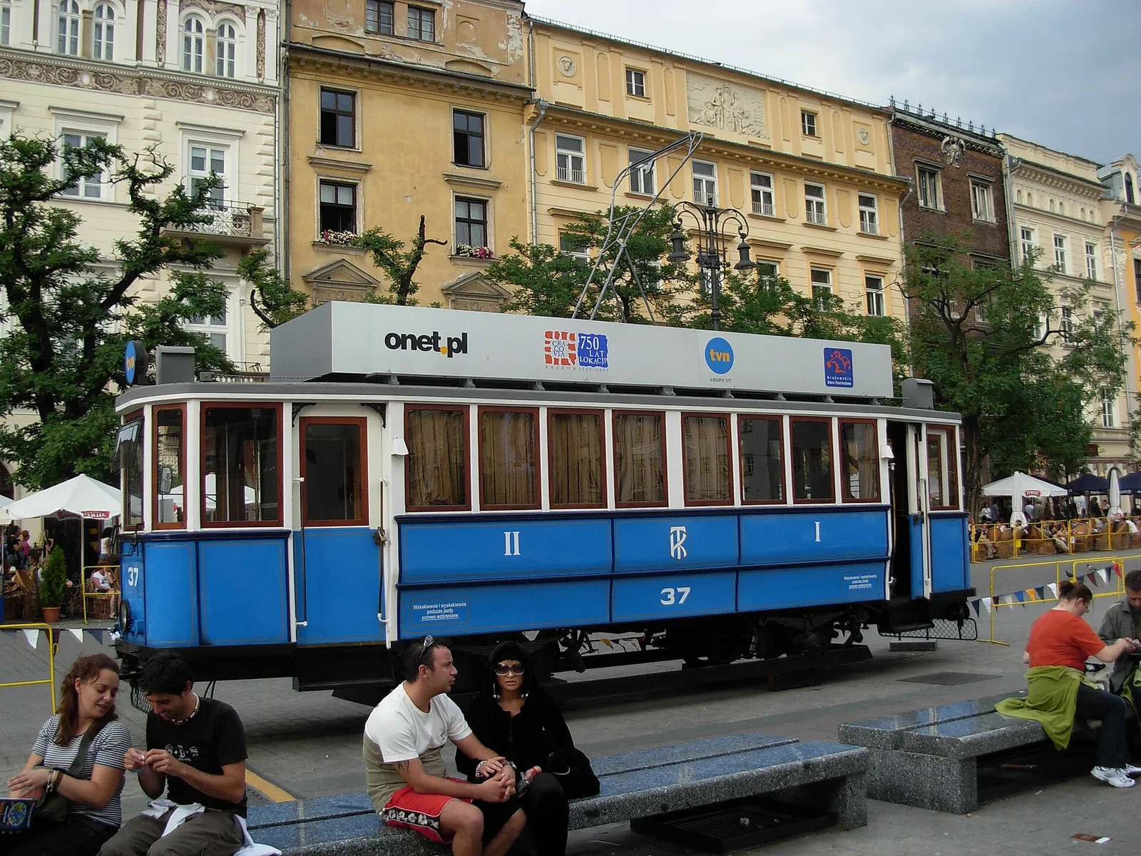 A vintage blue tram in Krakow's Old Town