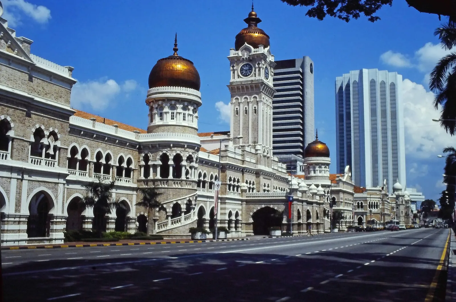 Copper domes of the Sultan Abdul Samad Building under blue sky