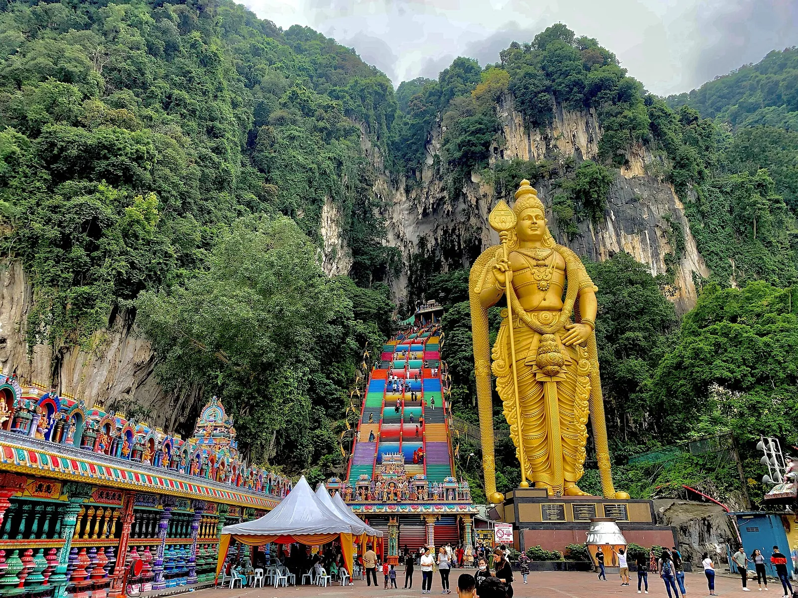 Rainbow stairs and golden Lord Murugan statue at Batu Caves