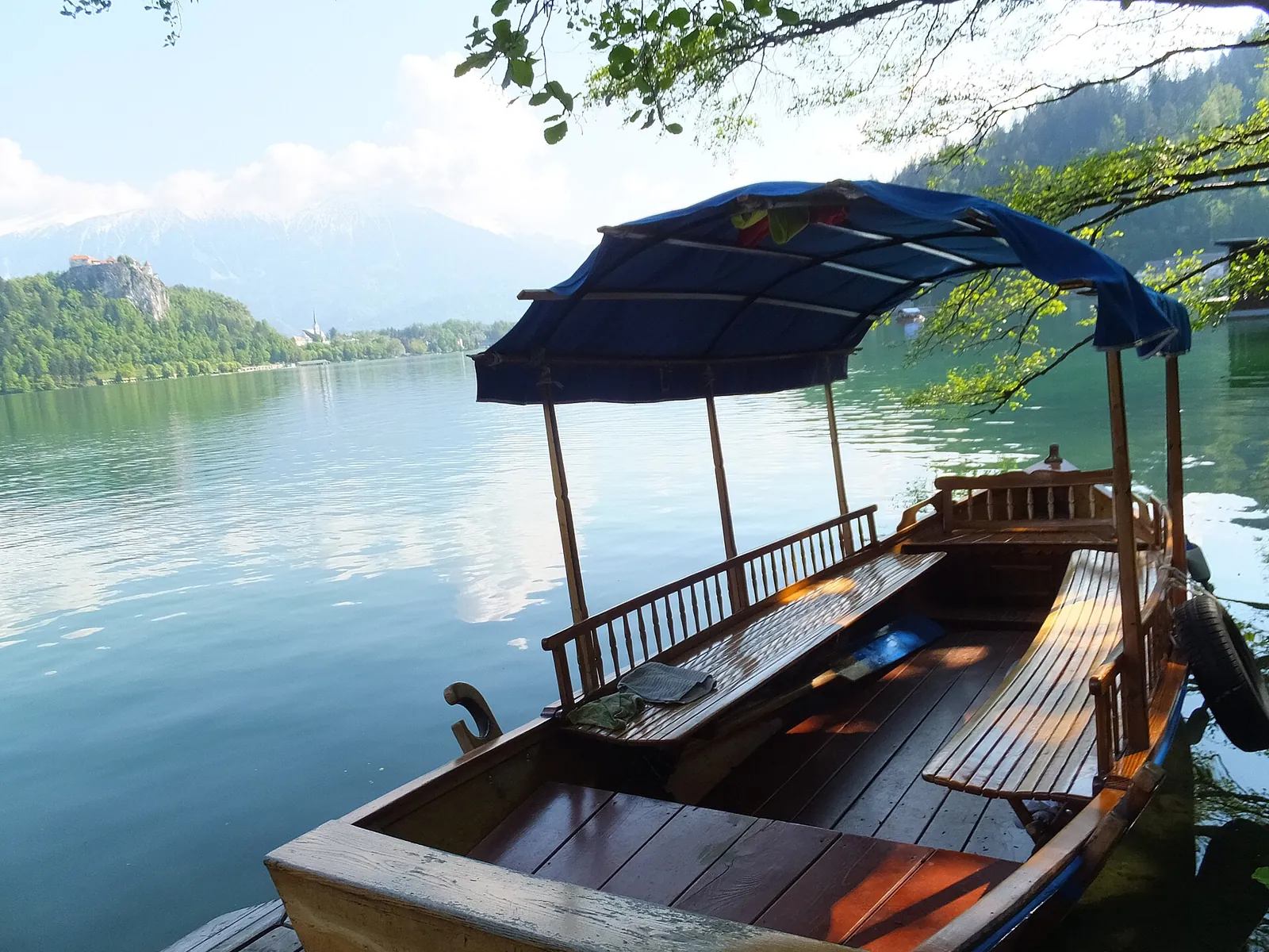 A traditional pletna boat waiting on Lake Bled